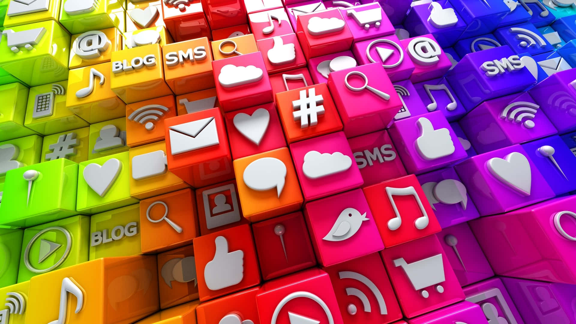 Social Media Icons 桌布 壁紙 — 充滿活力的彩虹色調3D立方體展示社交媒體圖示，如愛心、按讚和對話氣泡，形成動態的數位圖案。