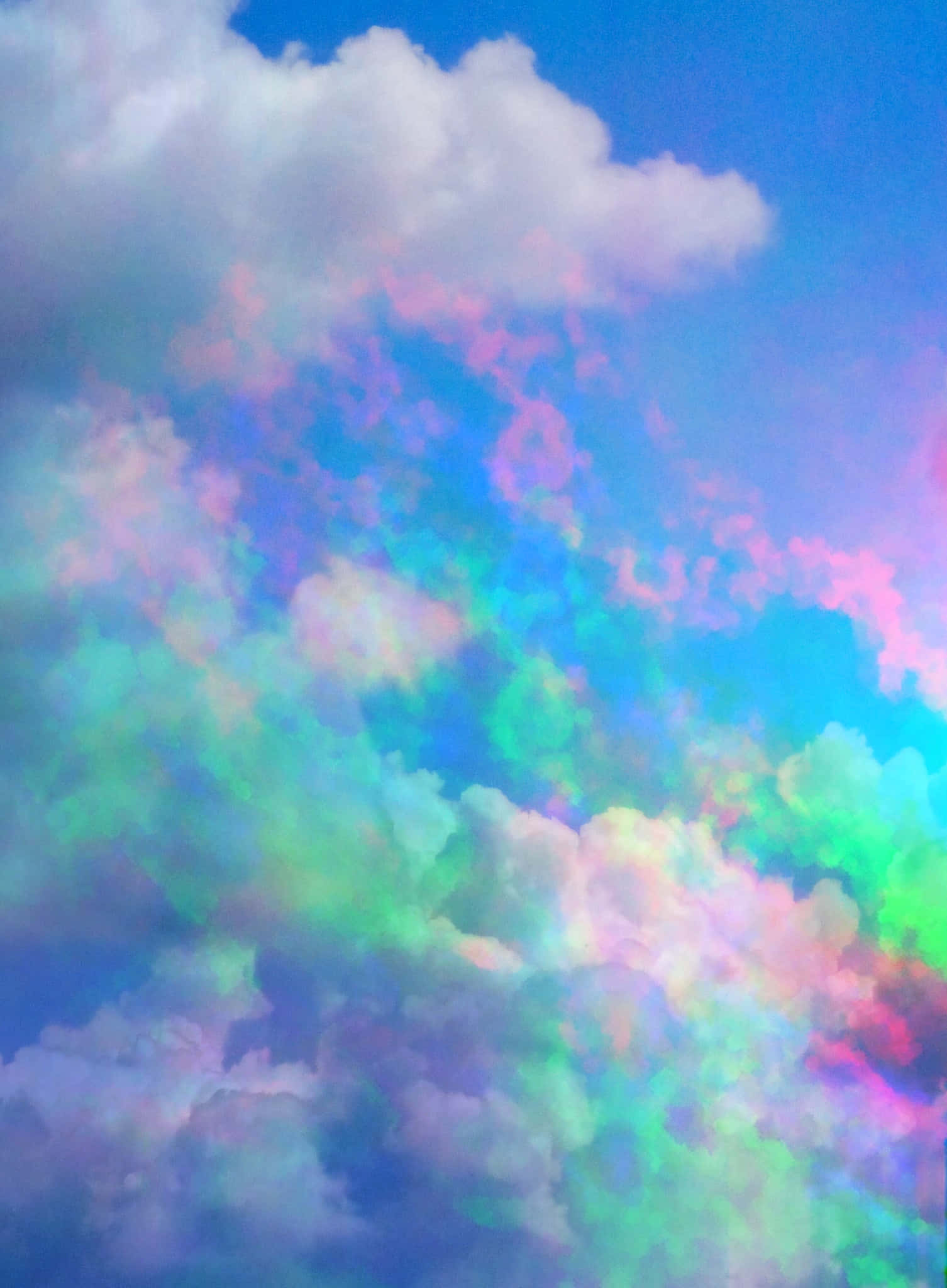 Clouds Aesthetics 桌布 壁紙 — 充滿活力的彩虹雲在明亮的藍天上旋轉，呈現夢幻般的柔和色彩爆炸。