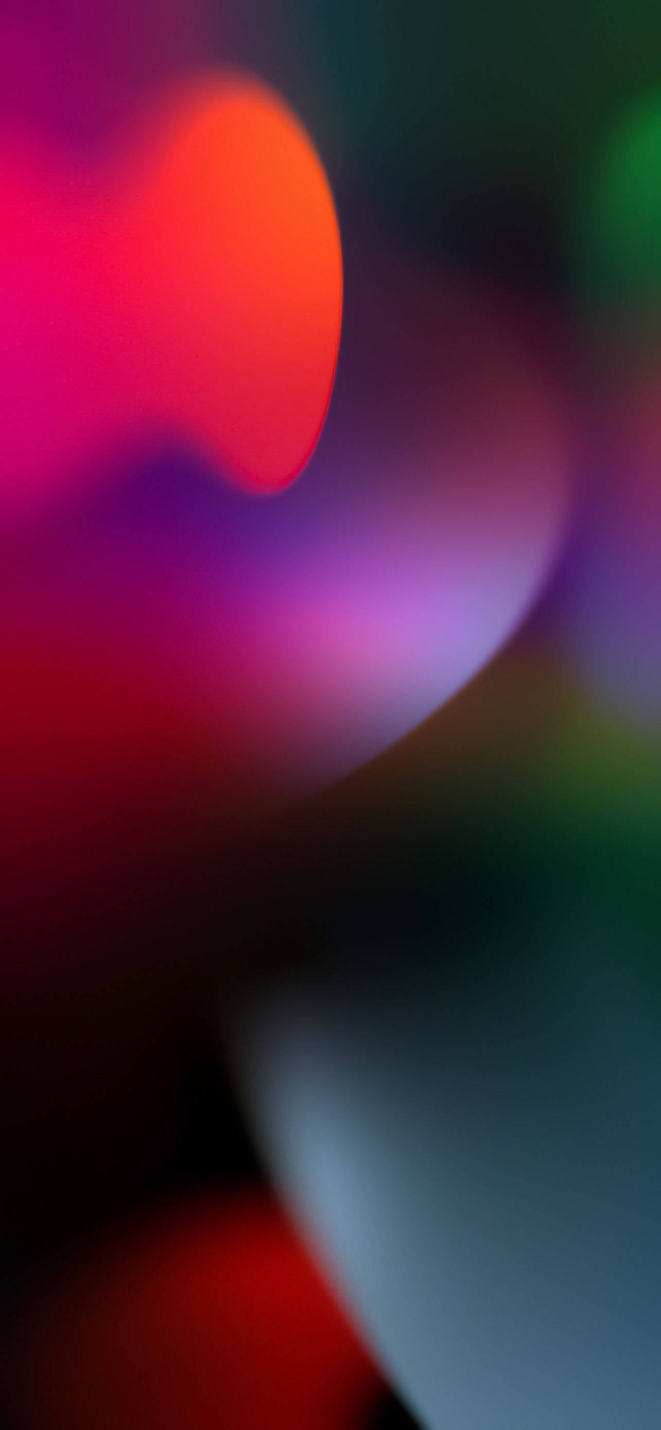 iOS 16 壁紙 桌布 壁紙 — 充滿活力的抽象散景燈光在深色漸變背景上融合成柔和發光的形狀。