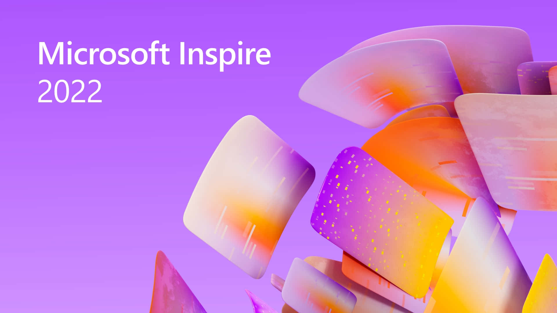 紫色、橙色和黃色的抽象漂浮數位形狀，帶有 Microsoft Inspire 2022 文字。 — Microsoft 壁紙