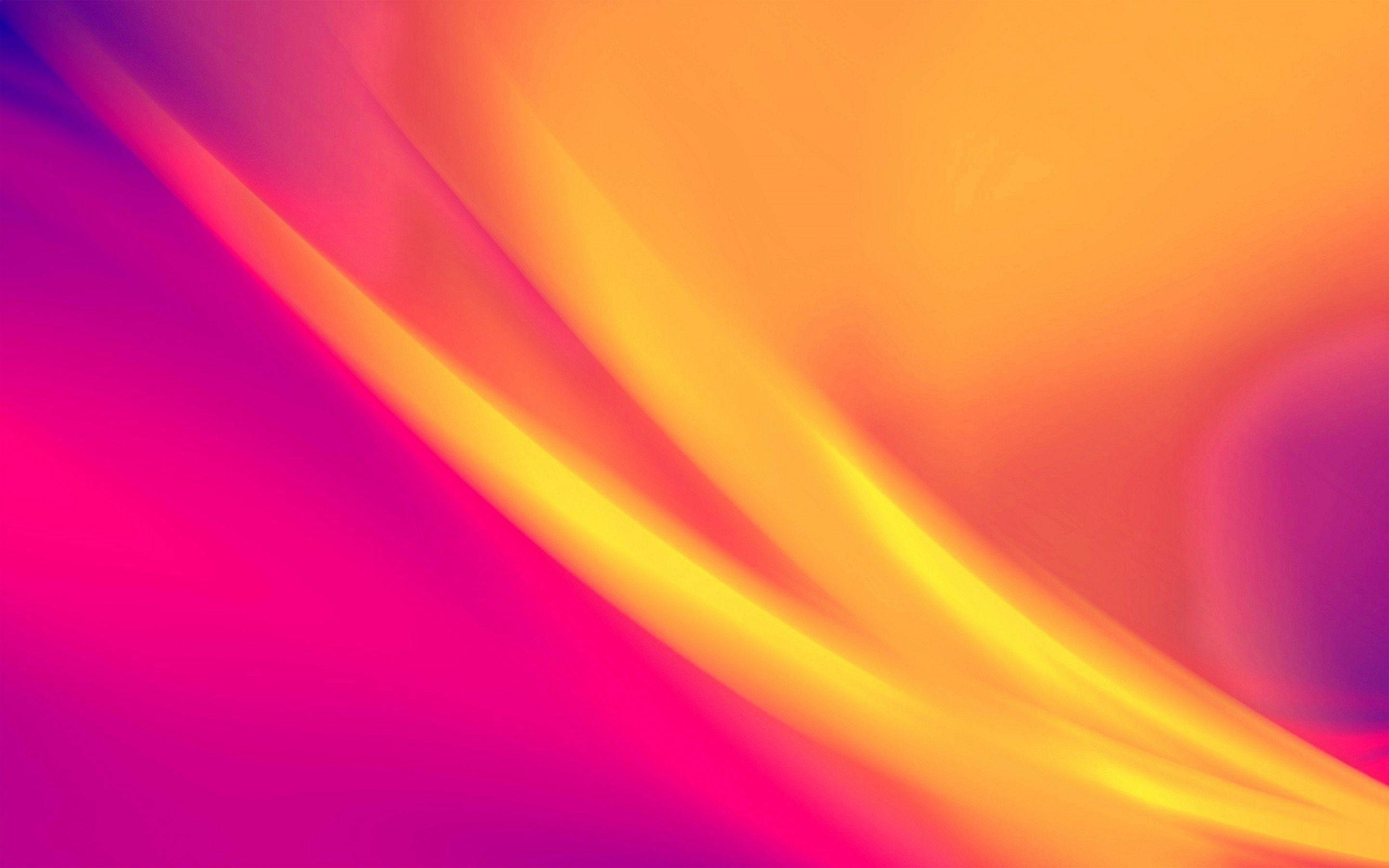 Gradient 桌布 壁紙 — 充滿活力的抽象漸層流動，呈現洋紅色、橙色和黃色，形成平滑的曲線。