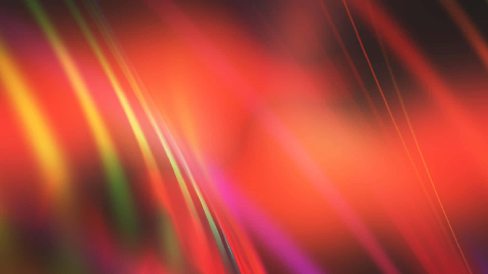 Gradient 桌布 壁紙 — 充滿活力的抽象紅色、橙色和紫色光條在深色背景上動態模糊。