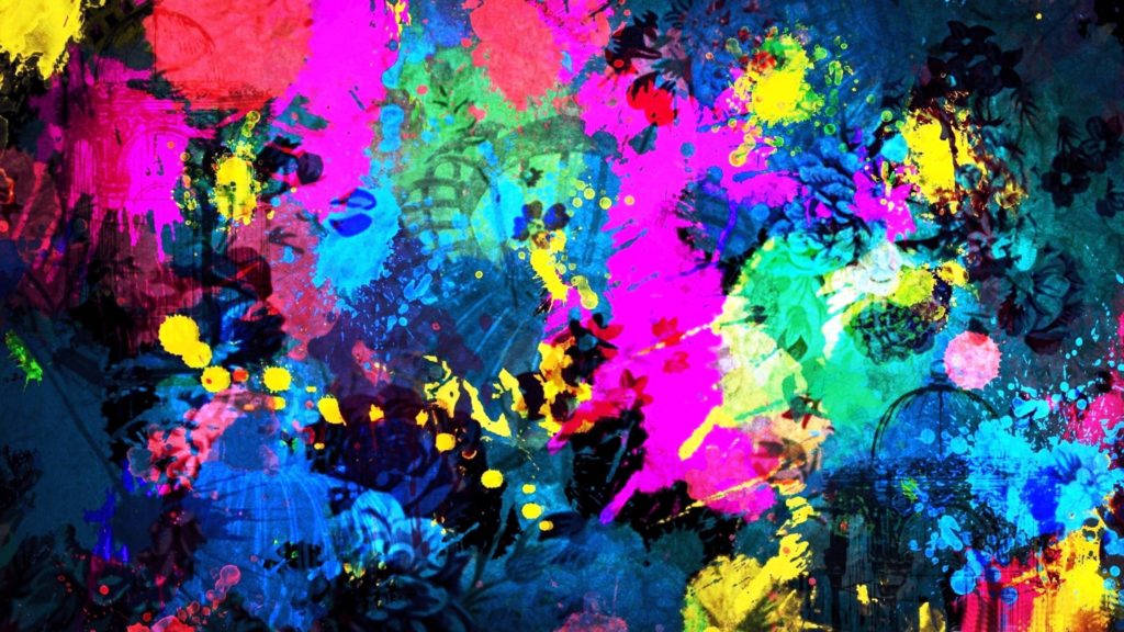 4K color 桌布 壁紙 — 充滿活力的抽象顏料飛濺在深色畫布上爆炸，呈現出粉紅色、黃色和藍色的電光色調。