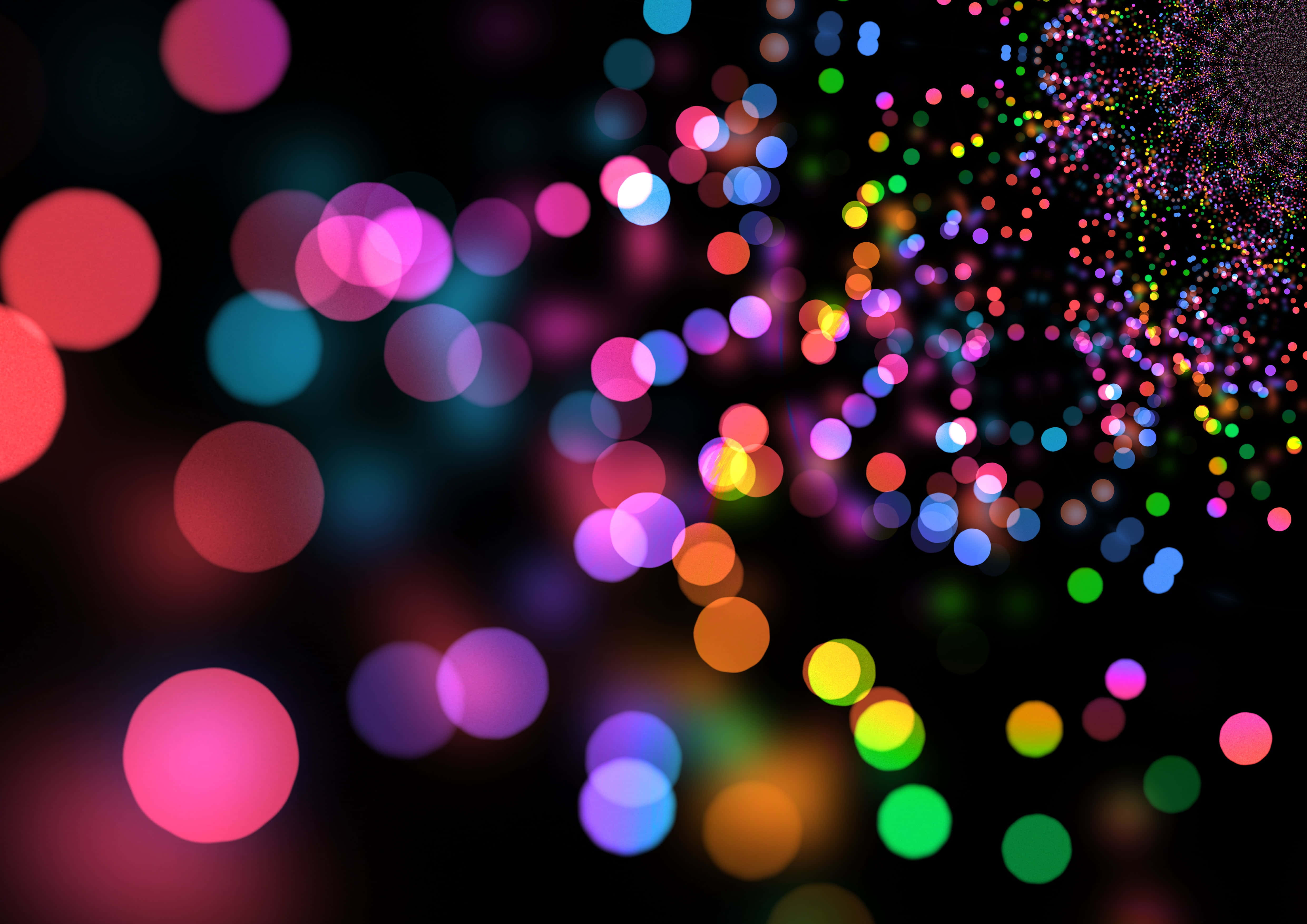 LED 桌布 壁紙 — 充滿活力的散景燈光在黑暗背景上形成色彩繽紛的瀑布，營造出夢幻般的抽象光芒。