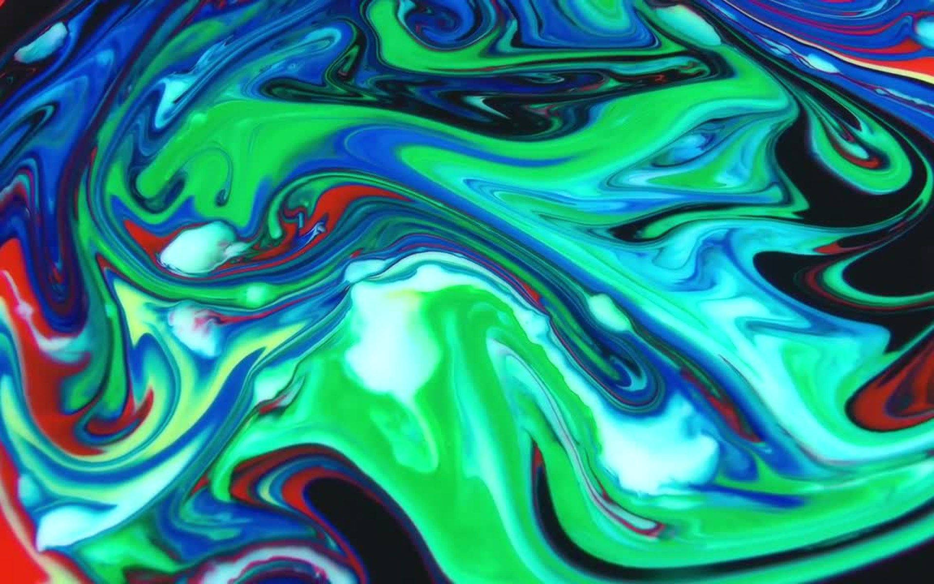 Marble Desktop 桌布 壁紙 — 充滿活力的旋轉抽象圖案，由螢光綠、藍、紅和黑色液體顏料在運動中形成。