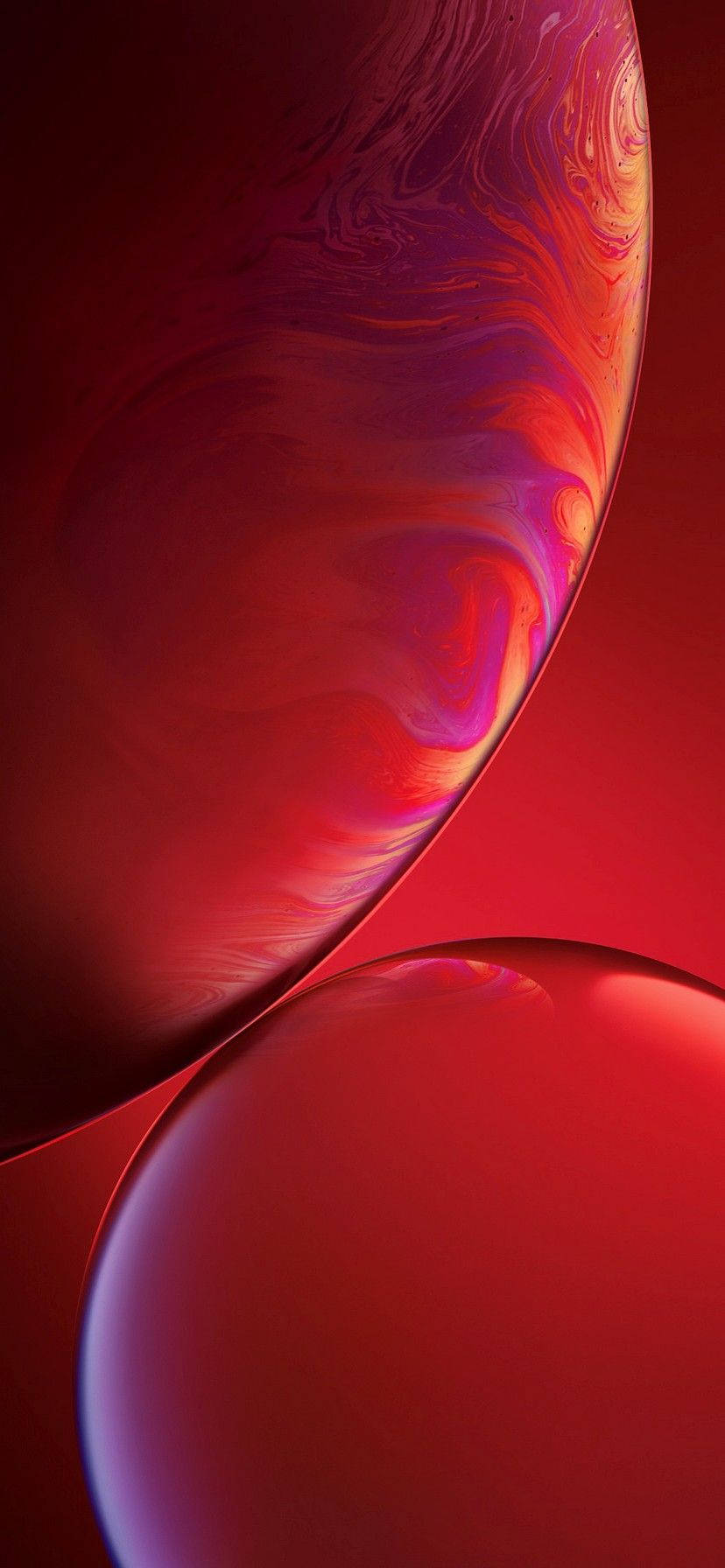iPhone XR 桌布 壁紙 — 充滿活力的旋轉紅色和紫色抽象球體漂浮在深紅色漸變背景上。