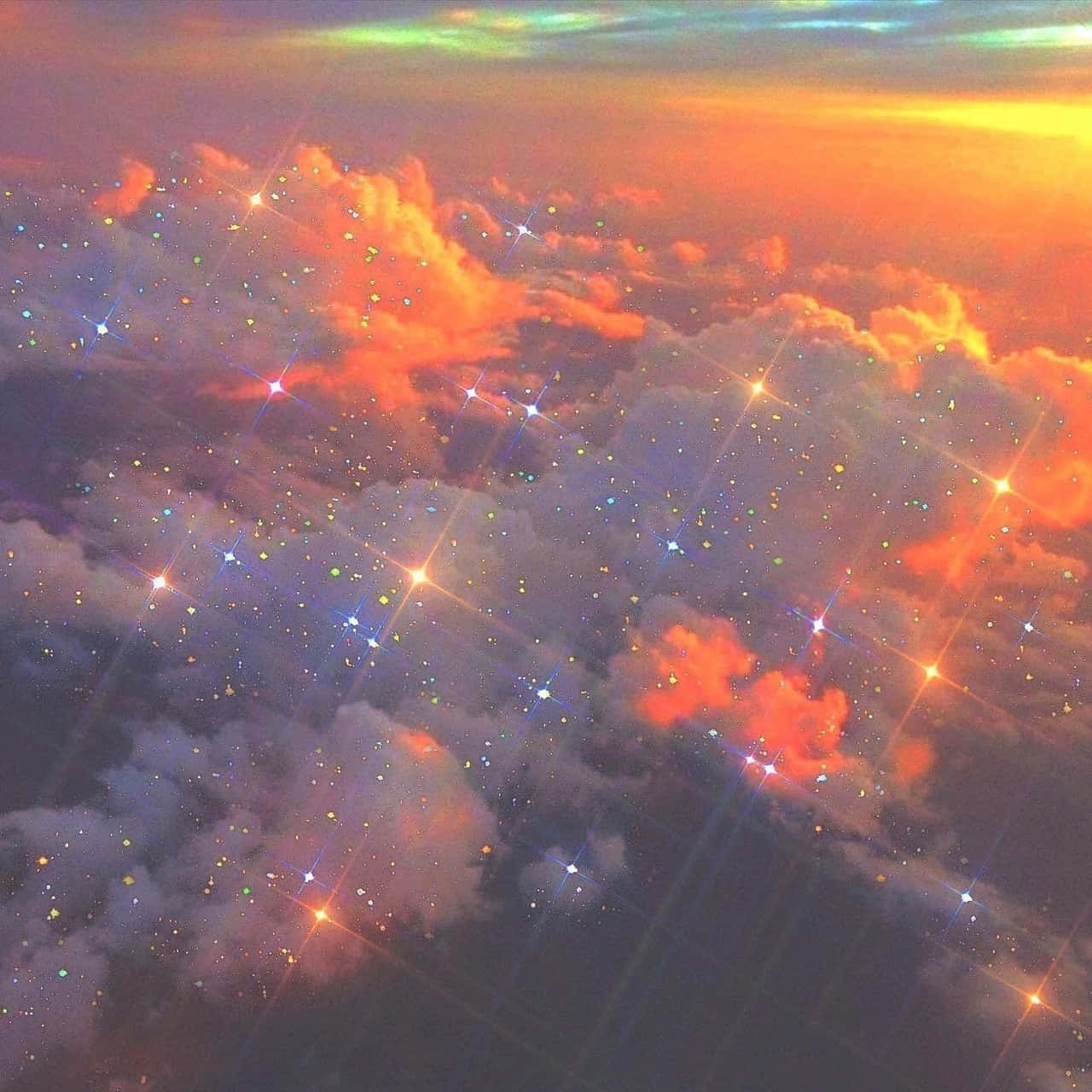 Cloud 桌布 壁紙 — 充滿活力的日落雲彩閃耀著橙色和紫色，閃爍的星星劃破天空，營造出夢幻般的天體場景。