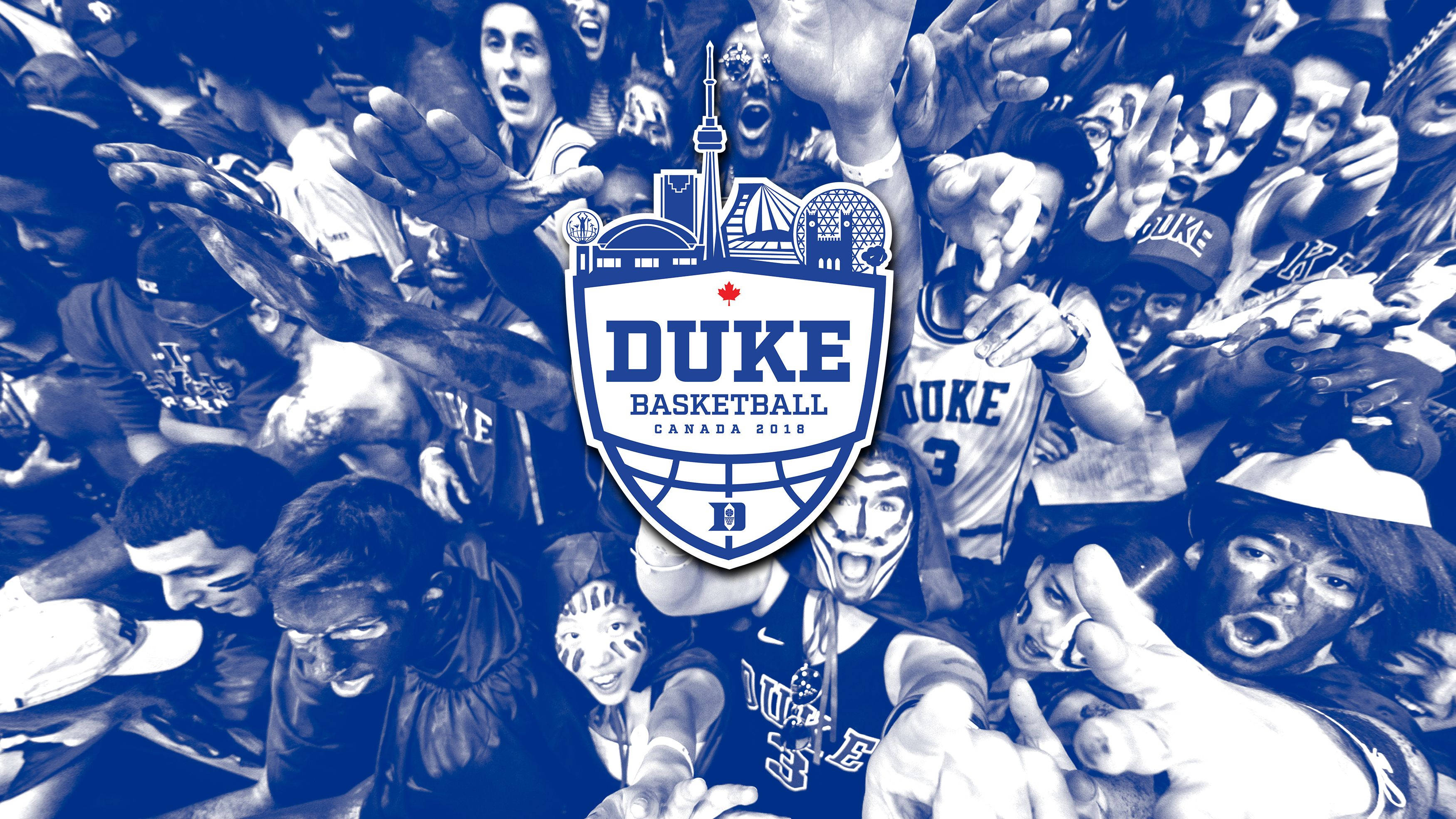 Duke Blue Devils 桌布 壁紙 — 充滿活力的杜克籃球迷人群，身穿藍白配色，帶有球隊標誌和加拿大地標。