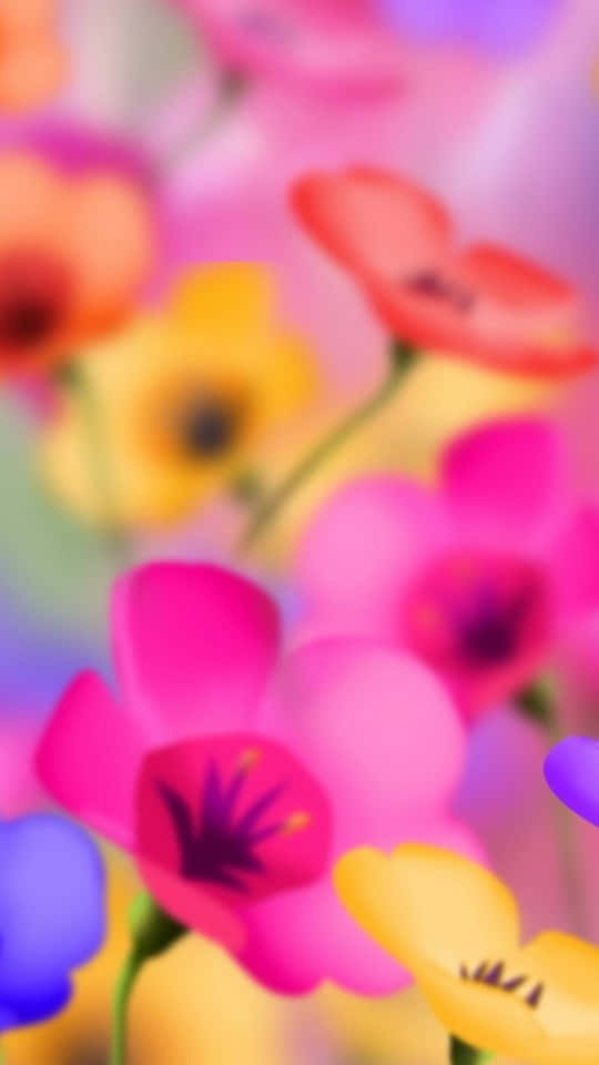 540x960 桌布 壁紙 — 充滿活力的模糊花朵，以粉紅、黃色和藍色呈現，營造出夢幻多彩的抽象花卉背景。