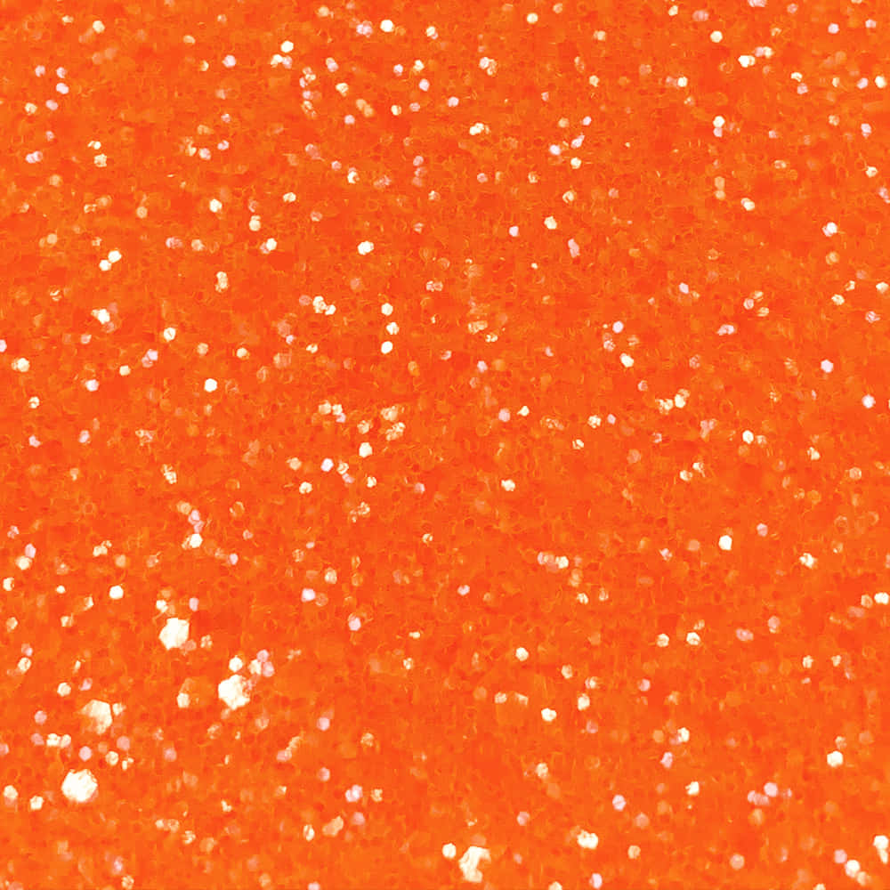 Orange Glitter 桌布 壁紙 — 充滿活力的橙色亮粉紋理，散落著白色閃光，營造出大膽閃爍的表面。