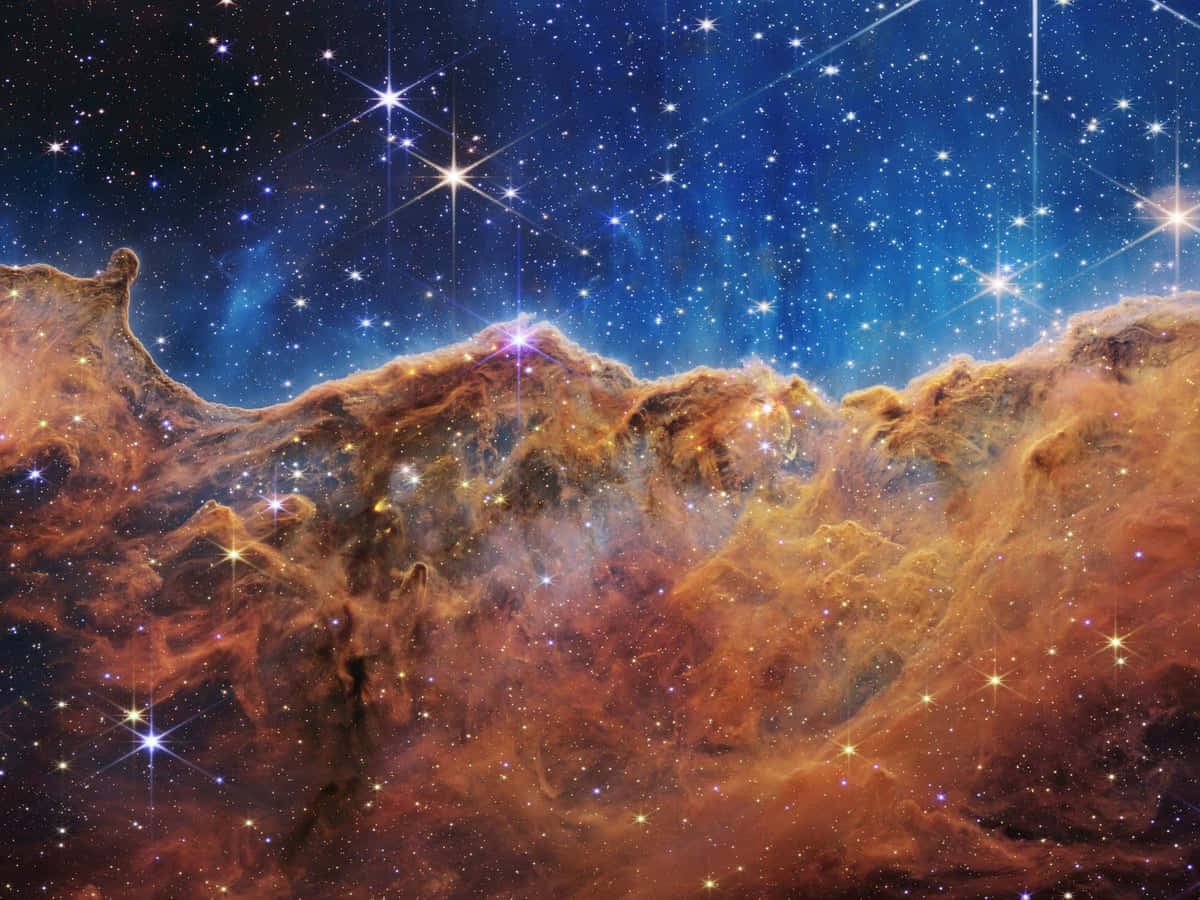太空美學動圖 桌布 壁紙 — 充滿活力的橙色和藍色宇宙雲在令人驚嘆的深空星雲中閃爍著星星的光芒。