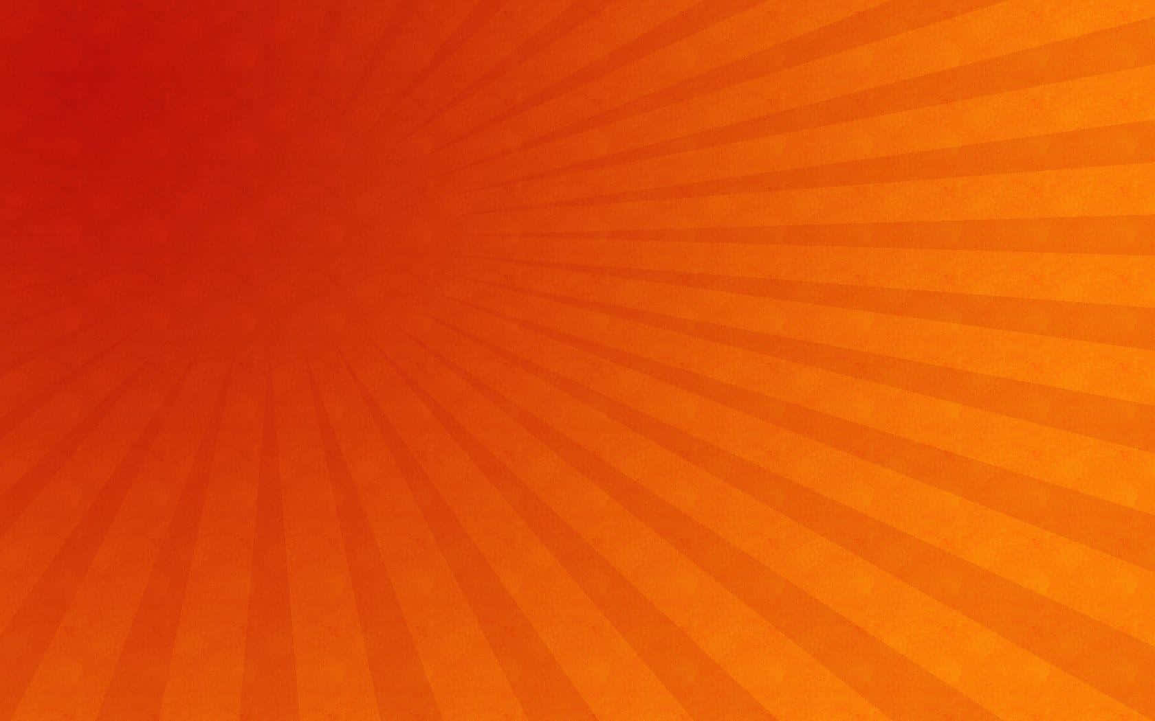 Radial 桌布 壁紙 — 充滿活力的橙色放射狀條紋從帶有紋理的中心散發出來，形成動態的太陽爆發圖案。