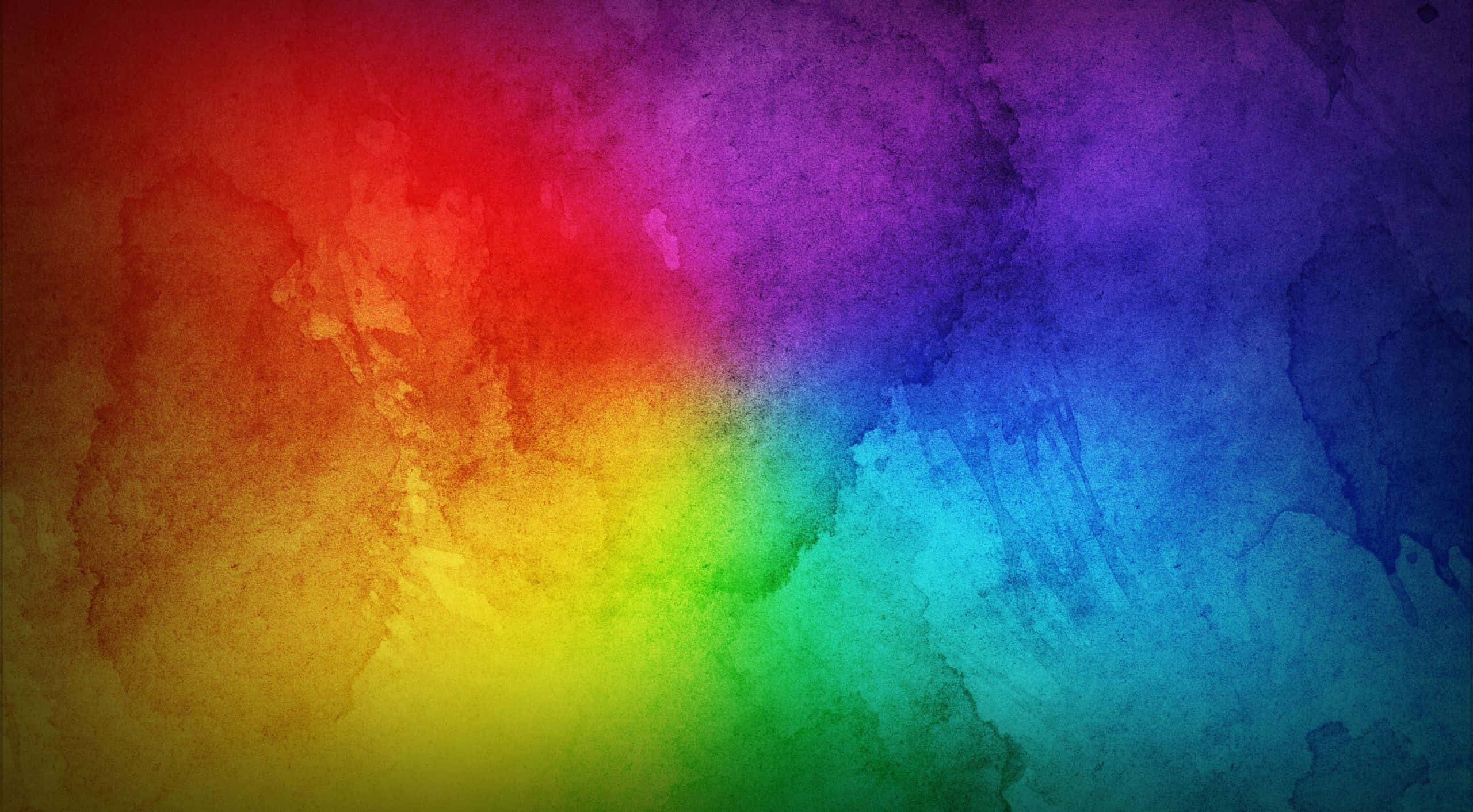 Rainbow Colours 桌布 壁紙 — 充滿活力的水彩彩虹漸變，帶有紋理筆觸，在畫布上從紅色過渡到藍色。