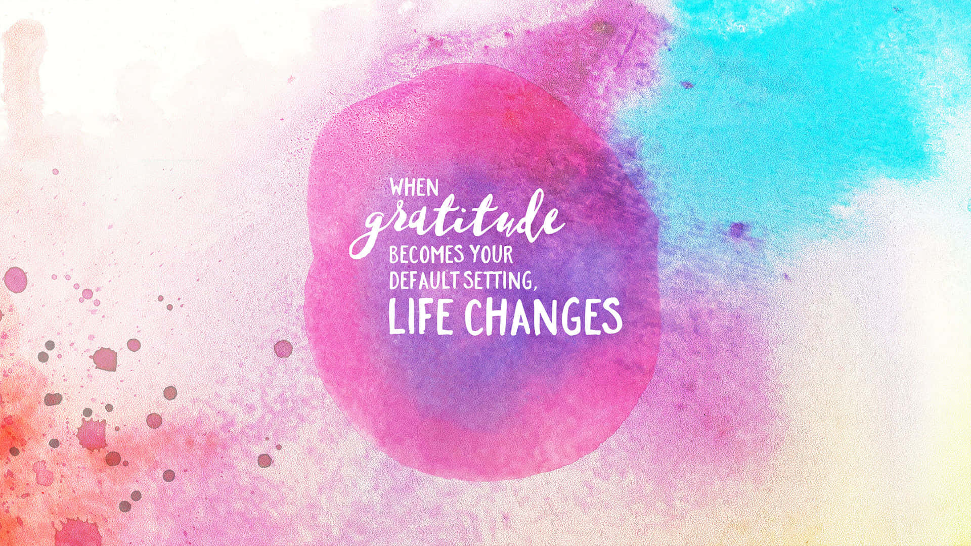 Gratitude 桌布 壁紙 — 充滿活力的水彩潑濺，粉紅、藍色和橙色，紫色圓圈中心有感恩的勵志語錄。