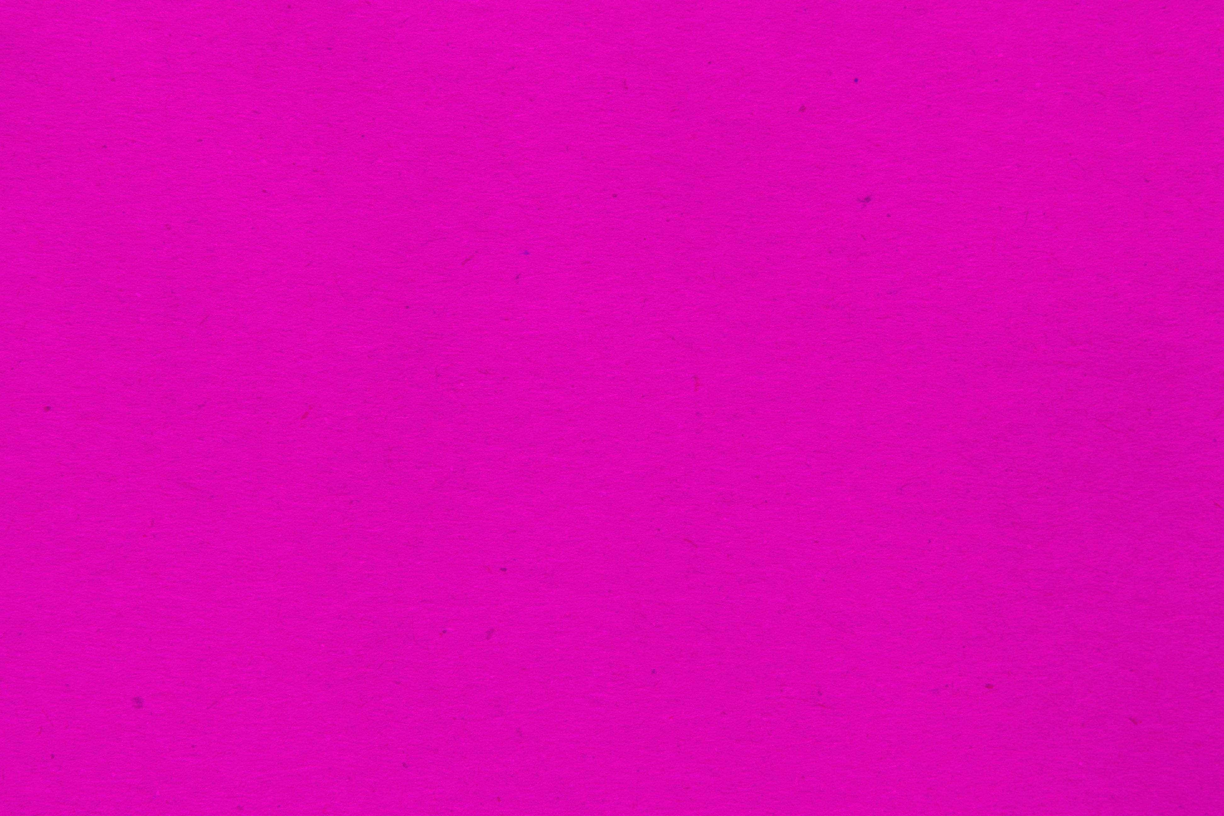 Cute Neon Pink 桌布 壁紙 — 充滿活力的洋紅色紋理紙張表面，帶有細微瑕疵和均勻色彩。