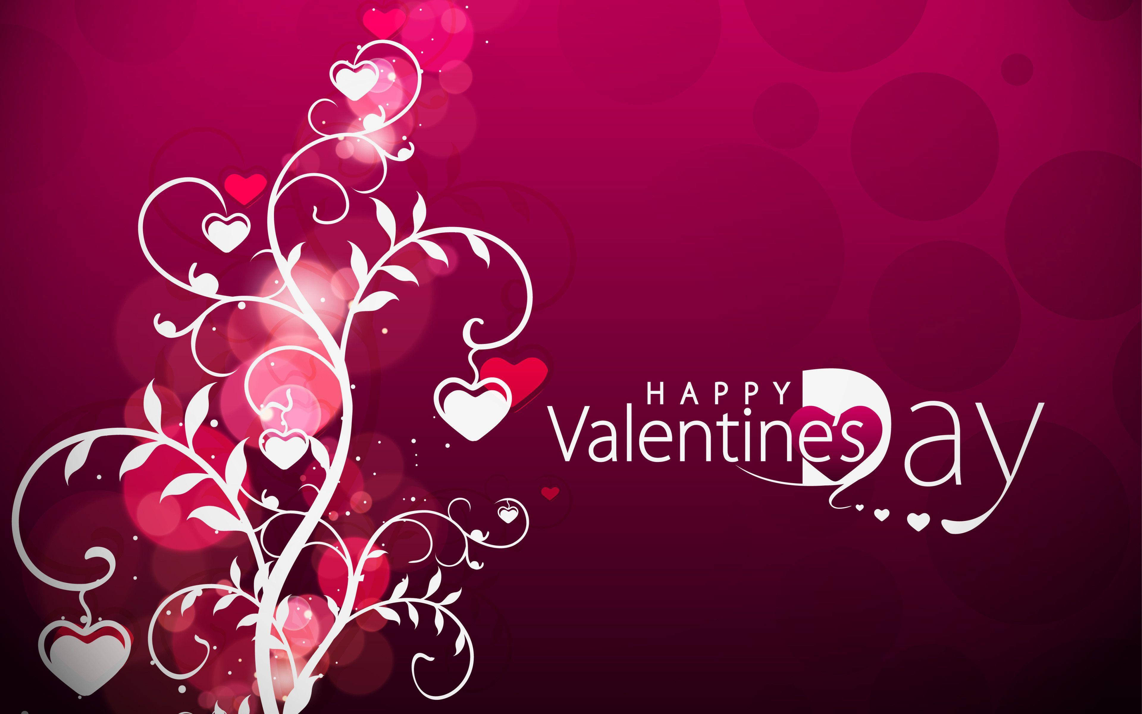 Valentines 桌布 壁紙 — 充滿活力的洋紅色背景上，優雅的白色旋轉藤蔓裝飾著心形，並以節日字體顯示文字「Happy Valentine's Day」。