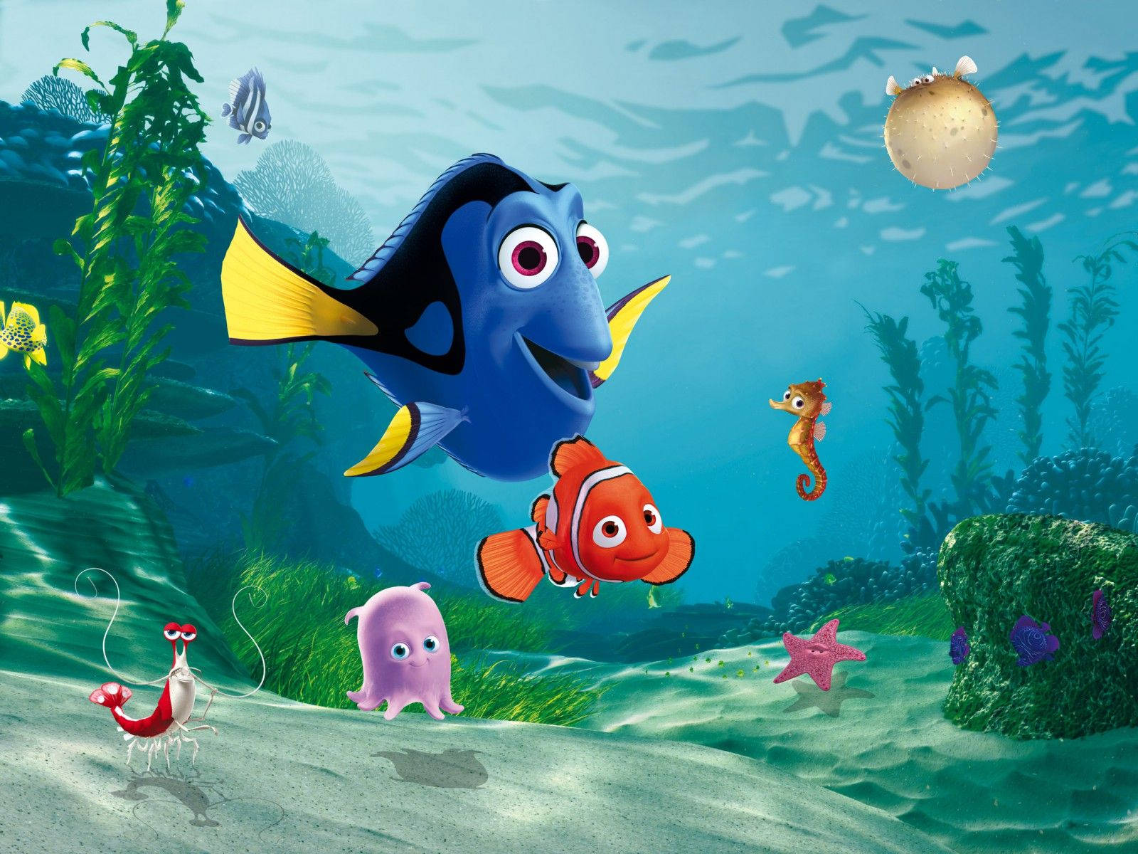 nemo 桌布 壁紙 — 充滿活力的海底場景，多莉和尼莫在色彩繽紛的珊瑚海洋生物和植物中游泳。