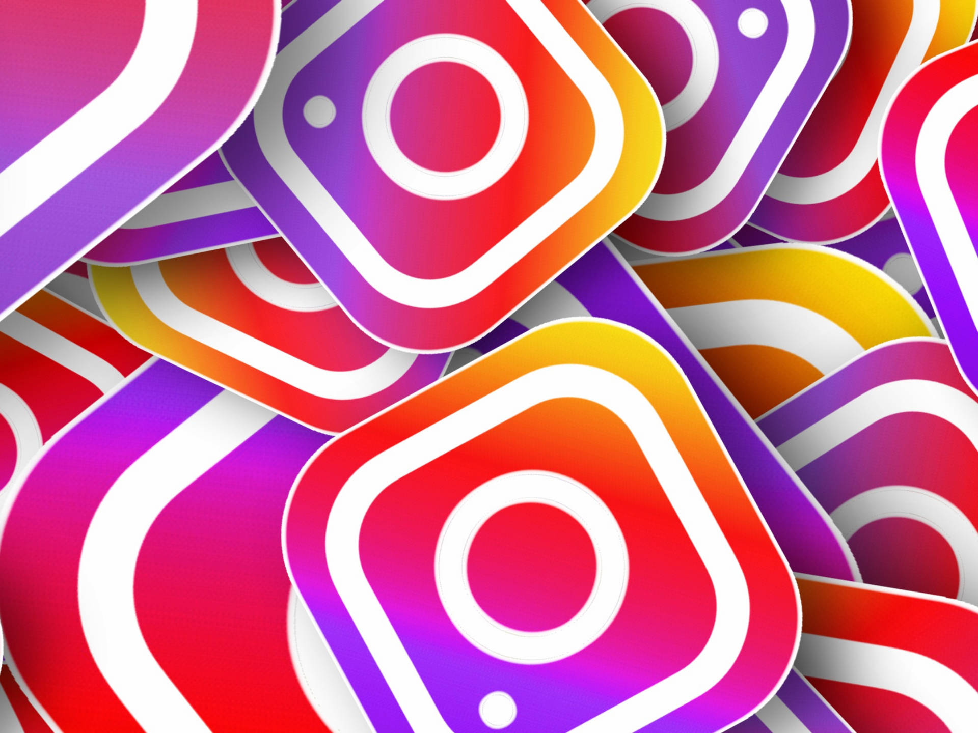 Cute Instagram 桌布 壁紙 — 充滿活力的漸層Instagram應用程式圖示重疊，形成動態多彩的數位圖案。