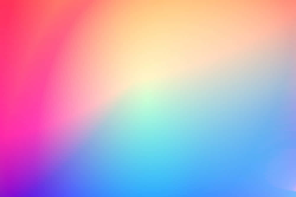 Colourful 桌布 壁紙 — 充滿活力的漸層壁紙，融合粉紅、紫、藍和黃色，呈現柔和夢幻的抽象圖案。