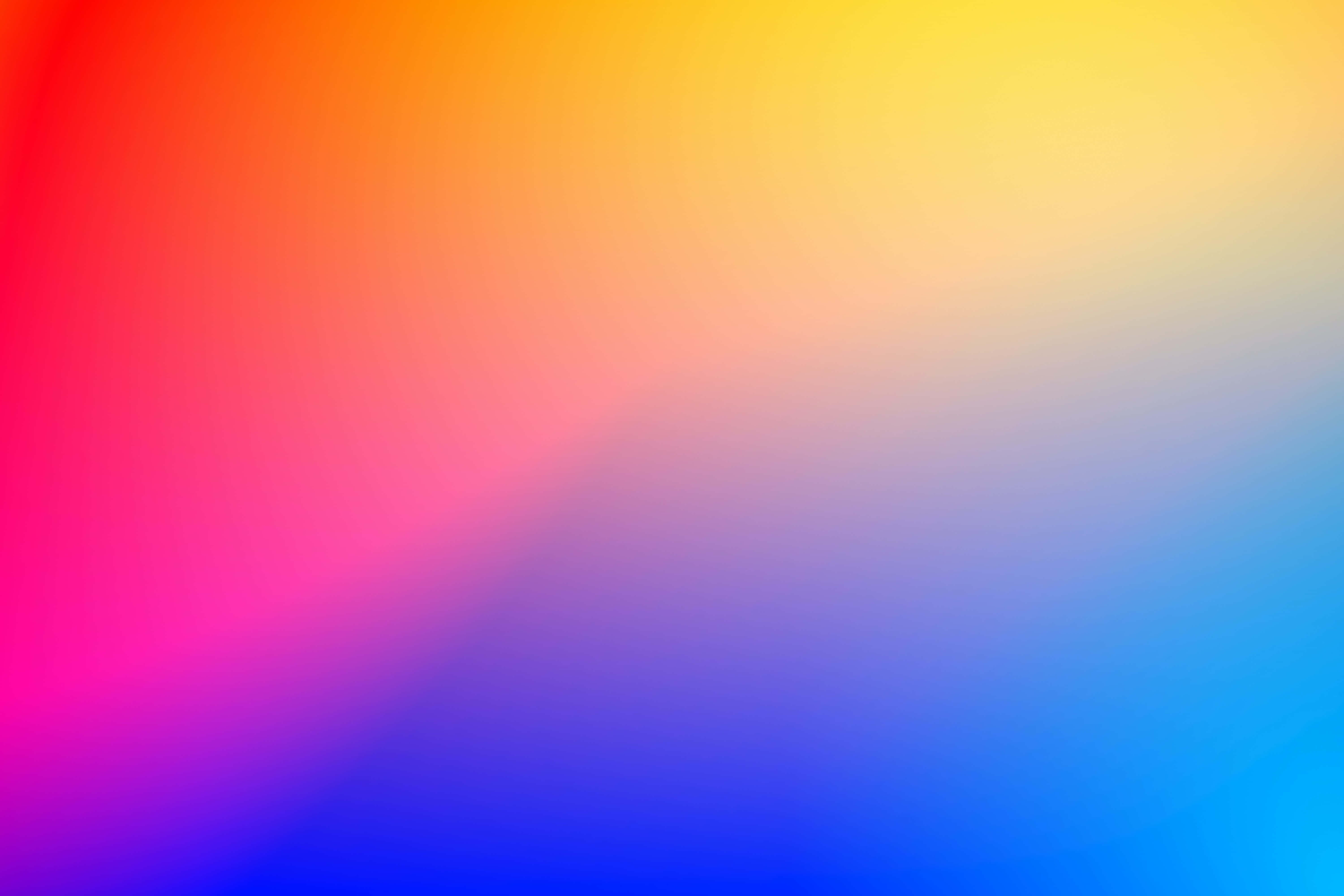 Orange Gradient 桌布 壁紙 — 充滿活力的漸變桌布，從紅色過渡到黃色再到藍色，帶有柔和模糊的過渡效果。