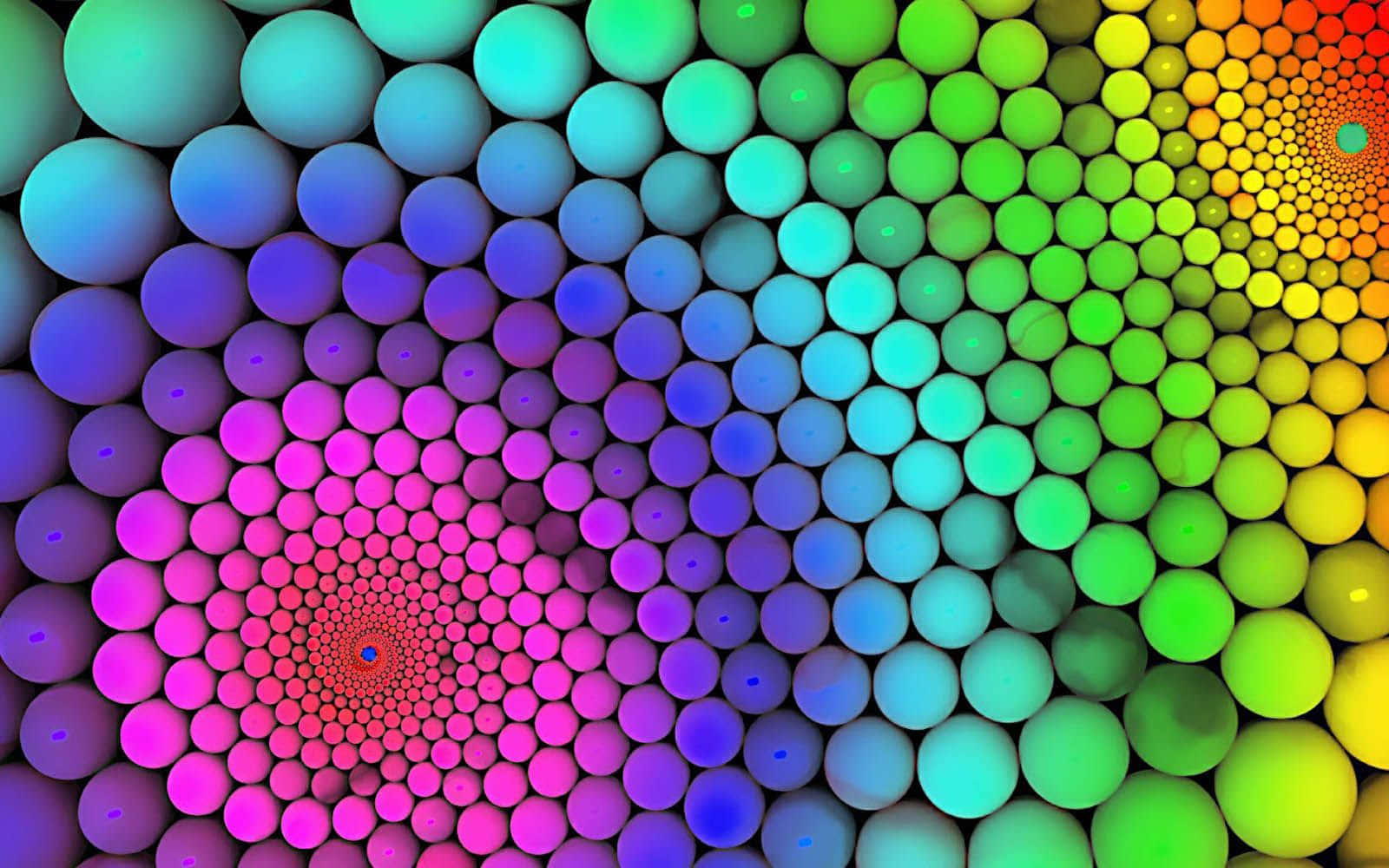 Swirls 桌布 壁紙 — 充滿活力的漸變球體向內螺旋，營造出迷人的彩虹漩渦效果。
