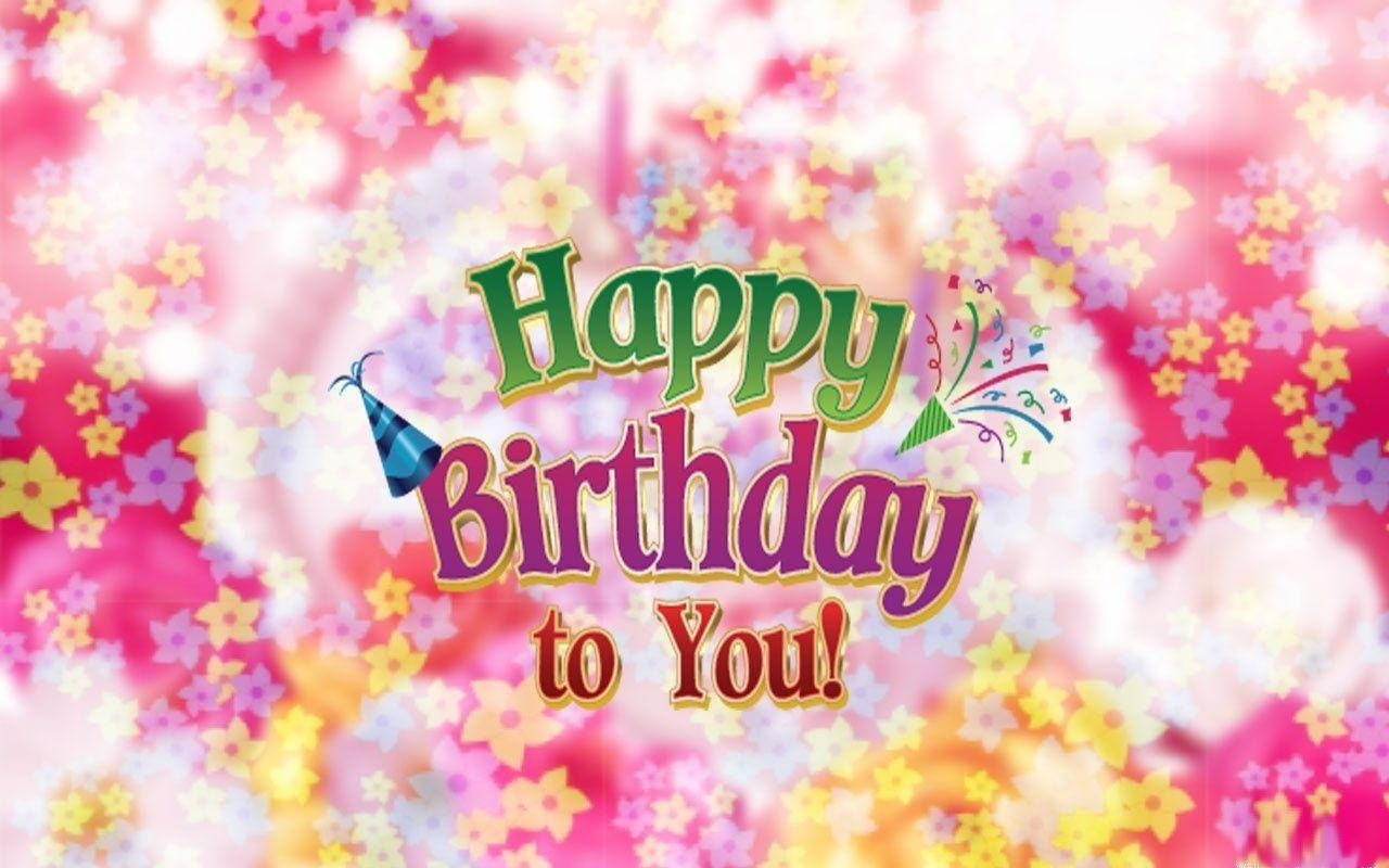 Greetings 桌布 壁紙 — 充滿活力的生日祝福，帶有彩色星星紙屑和節日派對帽，背景為柔和粉紅色。