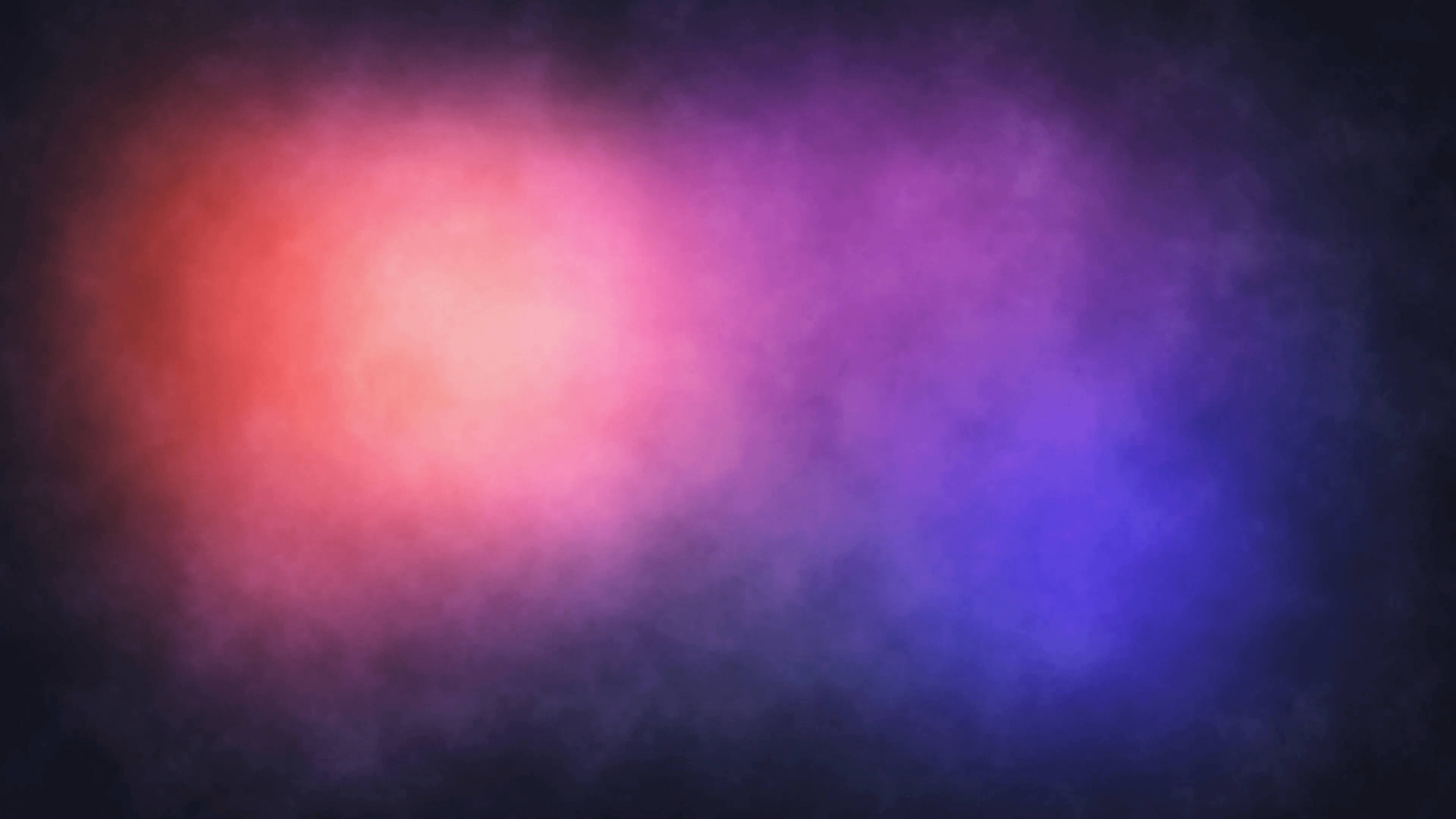 彩色動圖 桌布 壁紙 — 充滿活力的粉紅色和紫色星雲雲團在黑暗的宇宙背景下旋轉，營造出夢幻般的抽象場景。