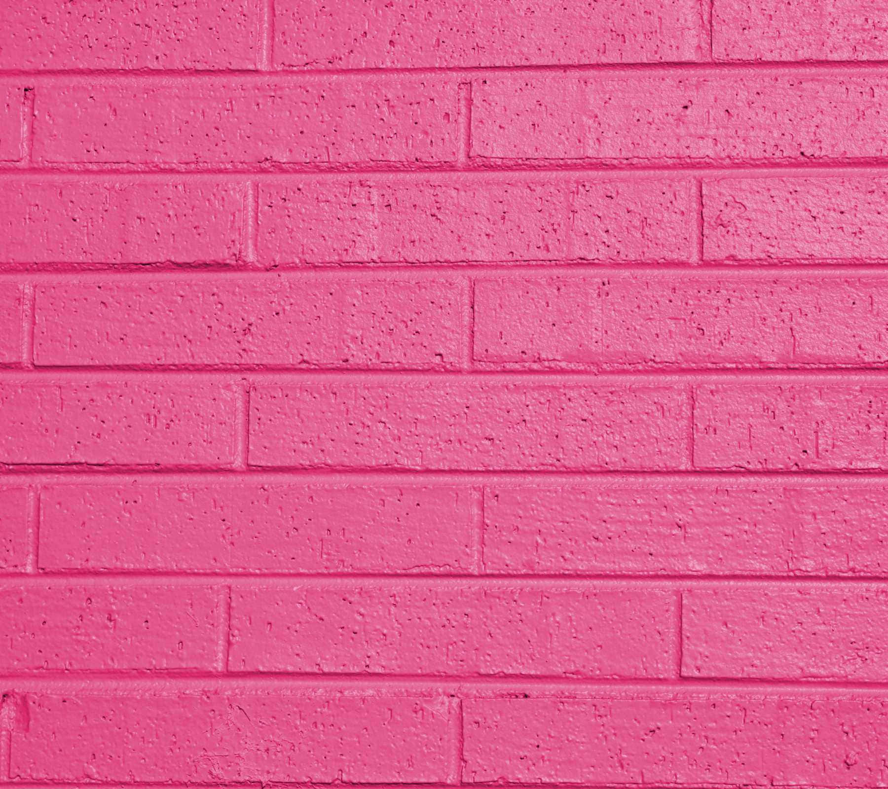 Tumblr Pink 桌布 壁紙 — 充滿活力的粉紅色油漆磚牆，帶有紋理表面和水平砂漿線。