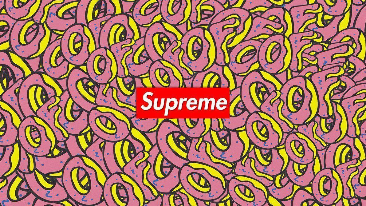 supreme 桌布 壁紙 — 充滿活力的粉紅色甜甜圈圖案，帶有黃色糖霜和藍色糖粒，填滿整個畫面，中央是一個大膽的紅色Supreme標誌。