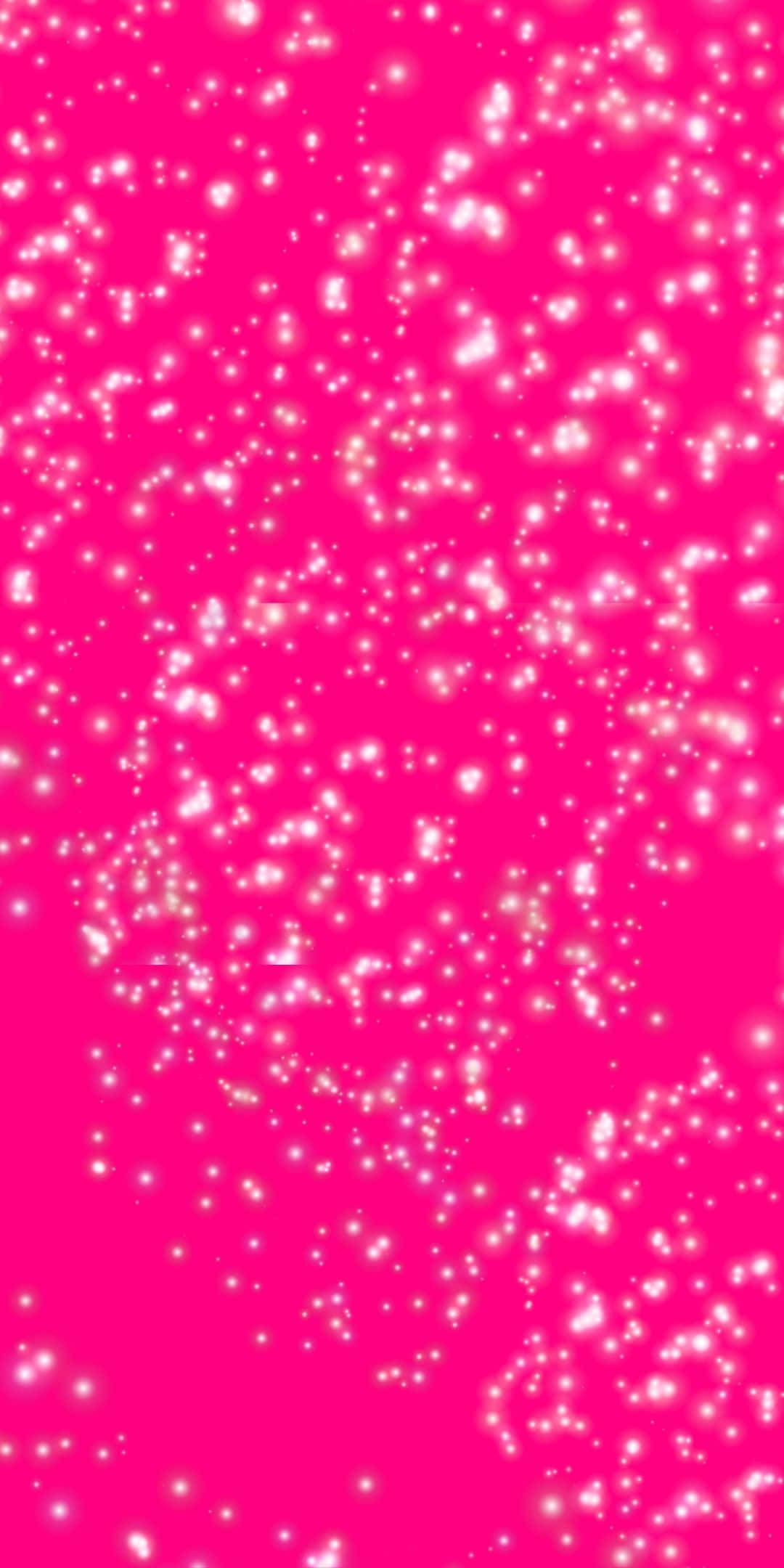 Sparkly Pink 桌布 壁紙 — 充滿活力的粉紅色背景，佈滿閃爍的白色亮粉粒子，以動態圖案漂浮。