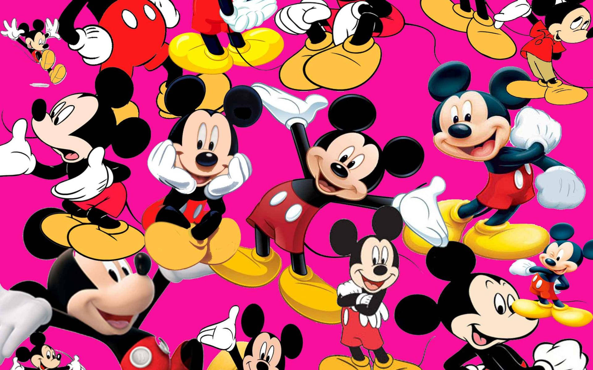 Mickey 桌布 壁紙 — 充滿活力的粉紅色背景，重複出現經典紅色短褲和黃色鞋子的快樂米奇老鼠角色。