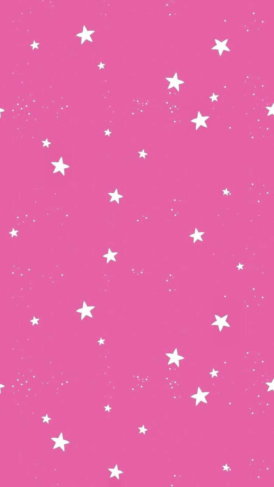 Pink Stars 桌布 壁紙 — 充滿活力的粉紅色背景，點綴著散落的白色星星和微小斑點，營造出夢幻的宇宙圖案。