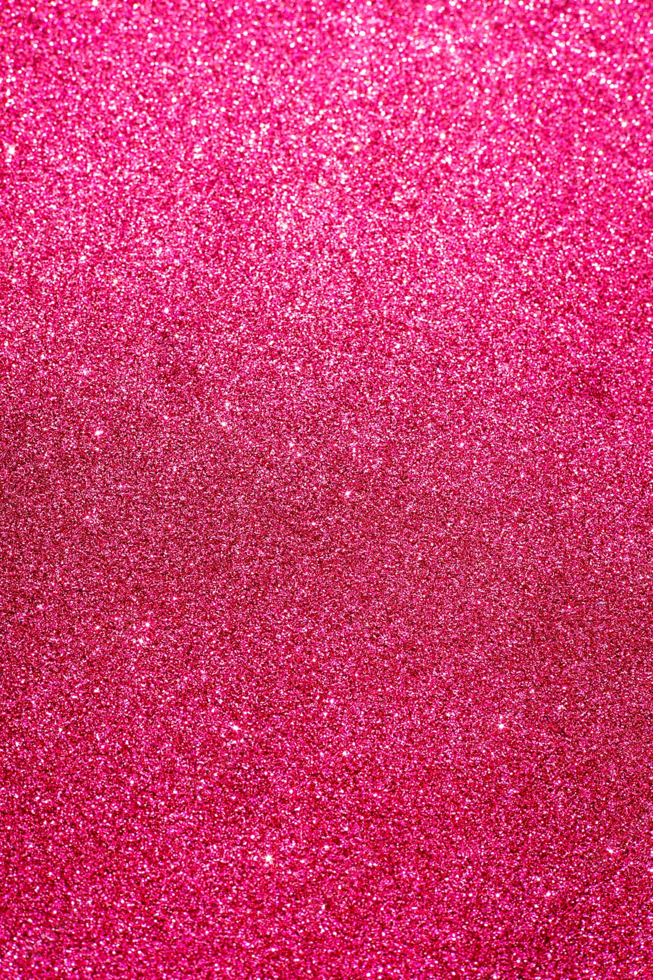 Hot Pink Glitter 桌布 壁紙 — 充滿活力的粉紅色閃粉漸變色在整個畫面中密集閃爍，營造出耀眼的紋理表面。