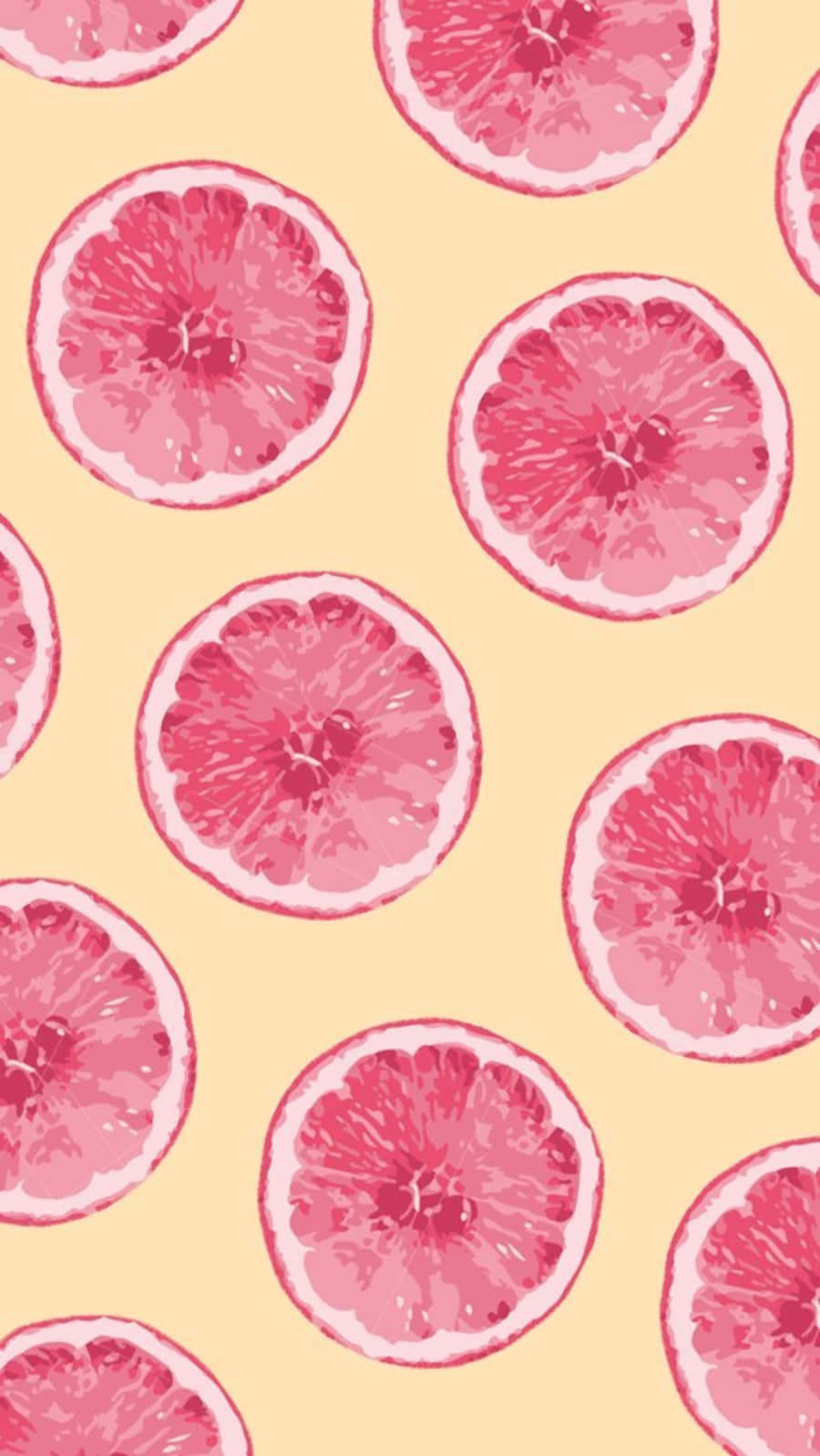 Pink Grapefruit 桌布 壁紙 — 充滿活力的粉紅葡萄柚片在柔和的黃色背景上以重複圖案排列。