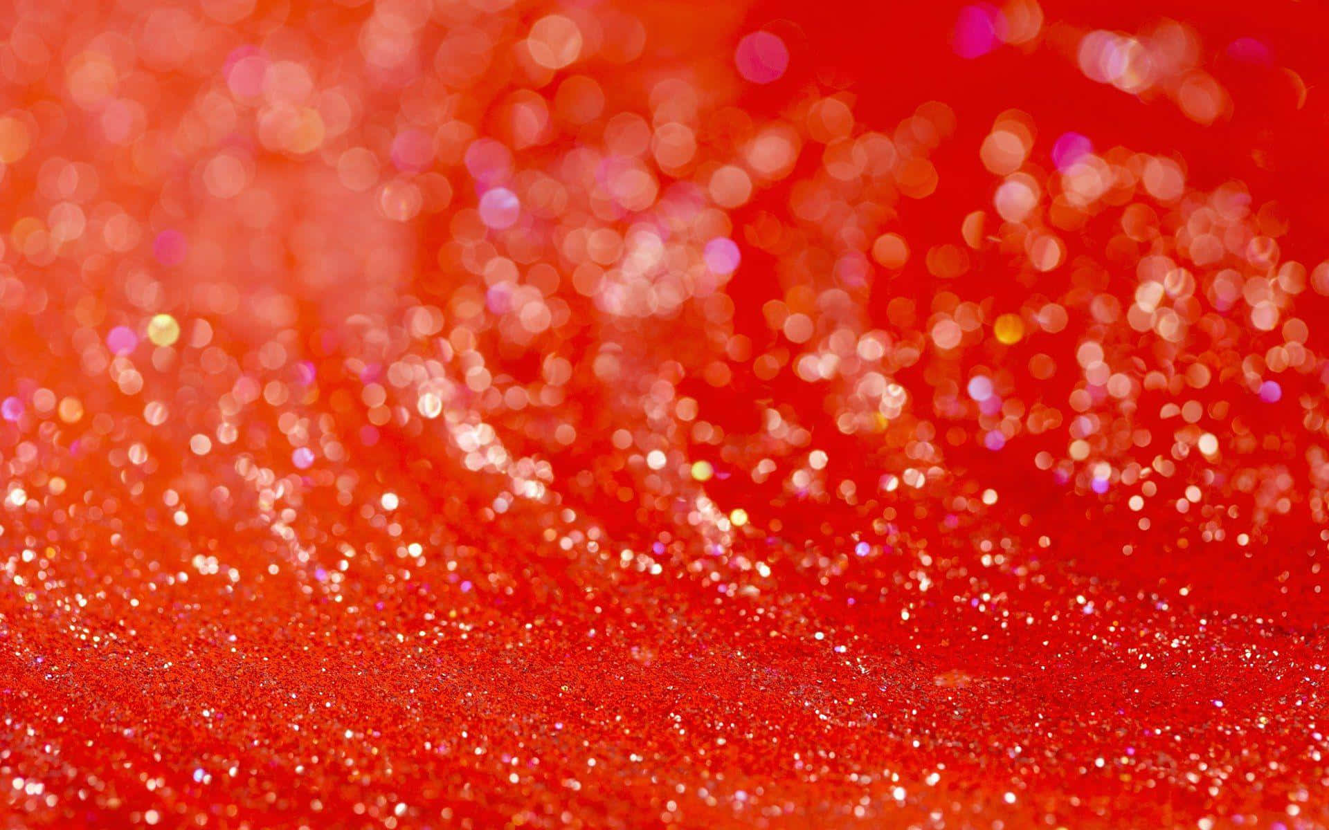 Orange Glitter 桌布 壁紙 — 充滿活力的紅色亮粉表面，搭配散景光效，營造出閃爍的節日質感。