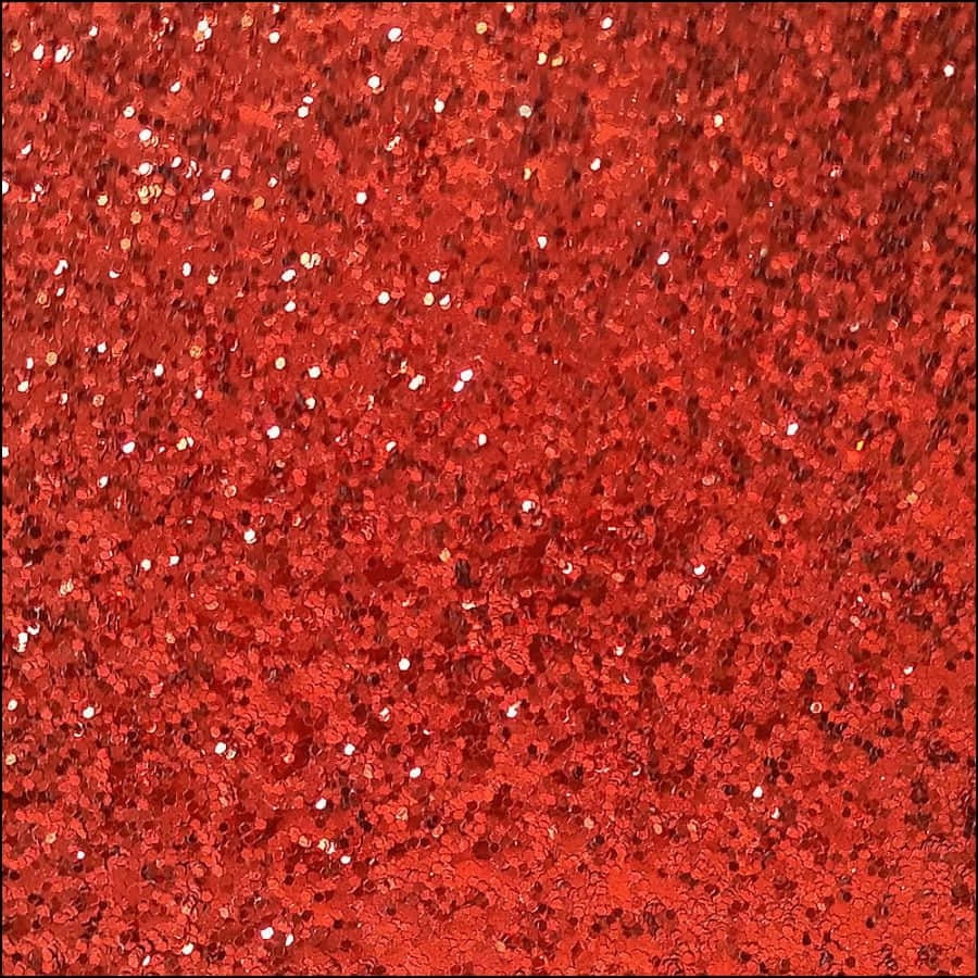 Red Glitter 桌布 壁紙 — 充滿活力的紅色亮粉質感，帶有閃爍的白色碎片，在光線下形成密集閃爍的圖案。