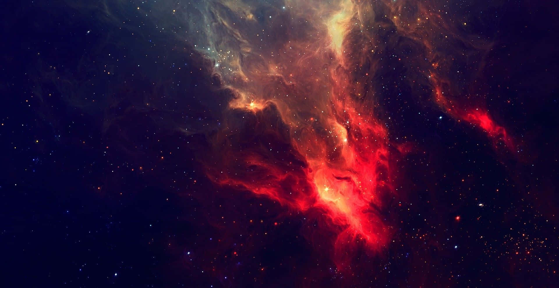 銀河 桌布 壁紙 — 充滿活力的紅色和橙色宇宙雲在戲劇性的太空星雲中，在星場中旋轉。