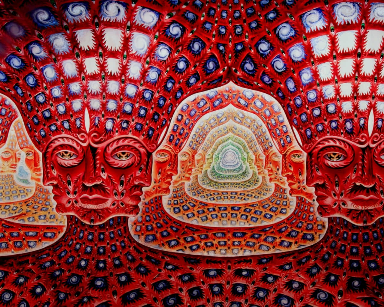 桌布 壁紙 — 充滿活力的紅色和藍色圖案面孔，帶有螺旋狀眼睛，向內凝視著色彩繽紛的同心曼陀羅。