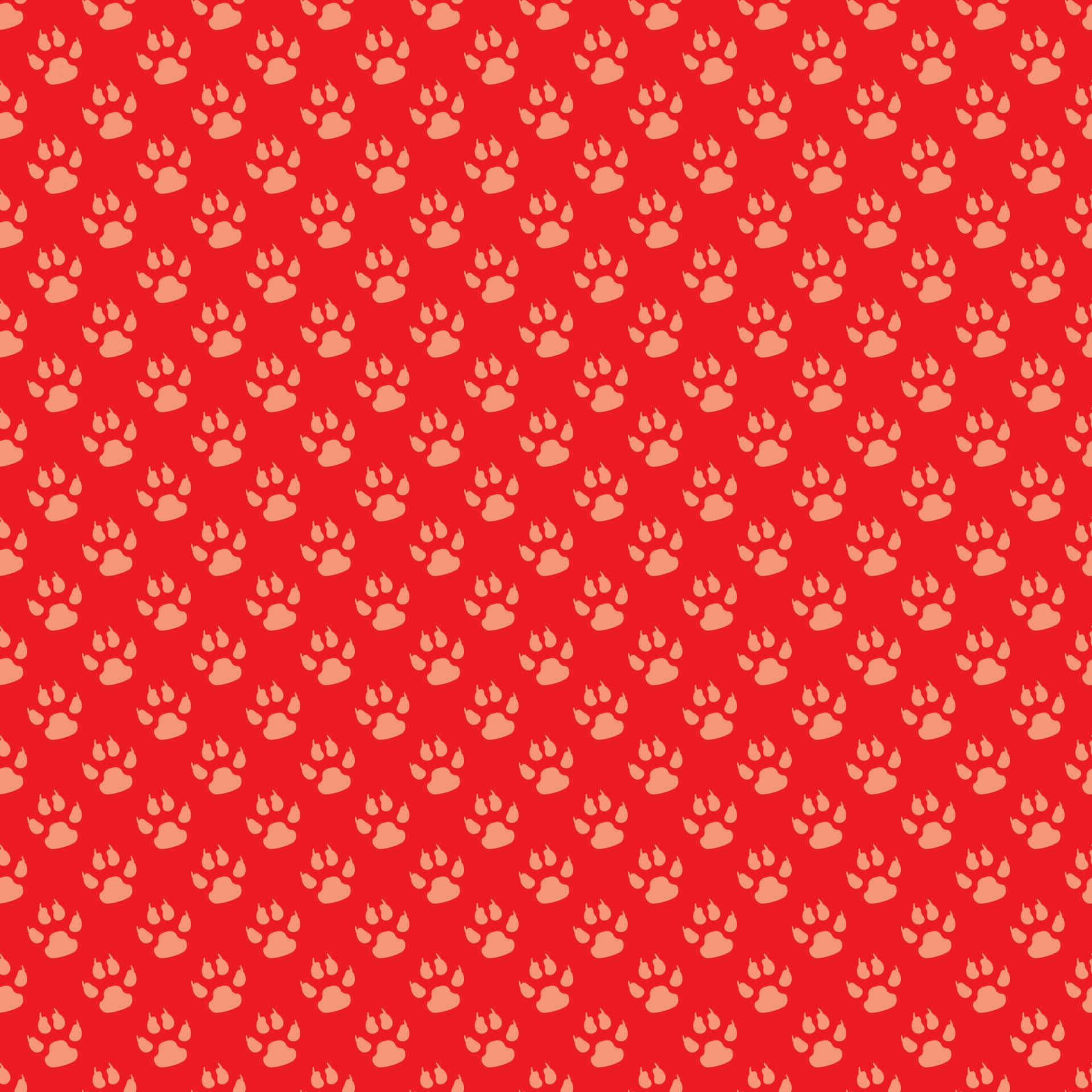 Paw Print 桌布 壁紙 — 充滿活力的紅色壁紙，上面覆蓋著重複的淺桃色狗爪印，形成無縫圖案。