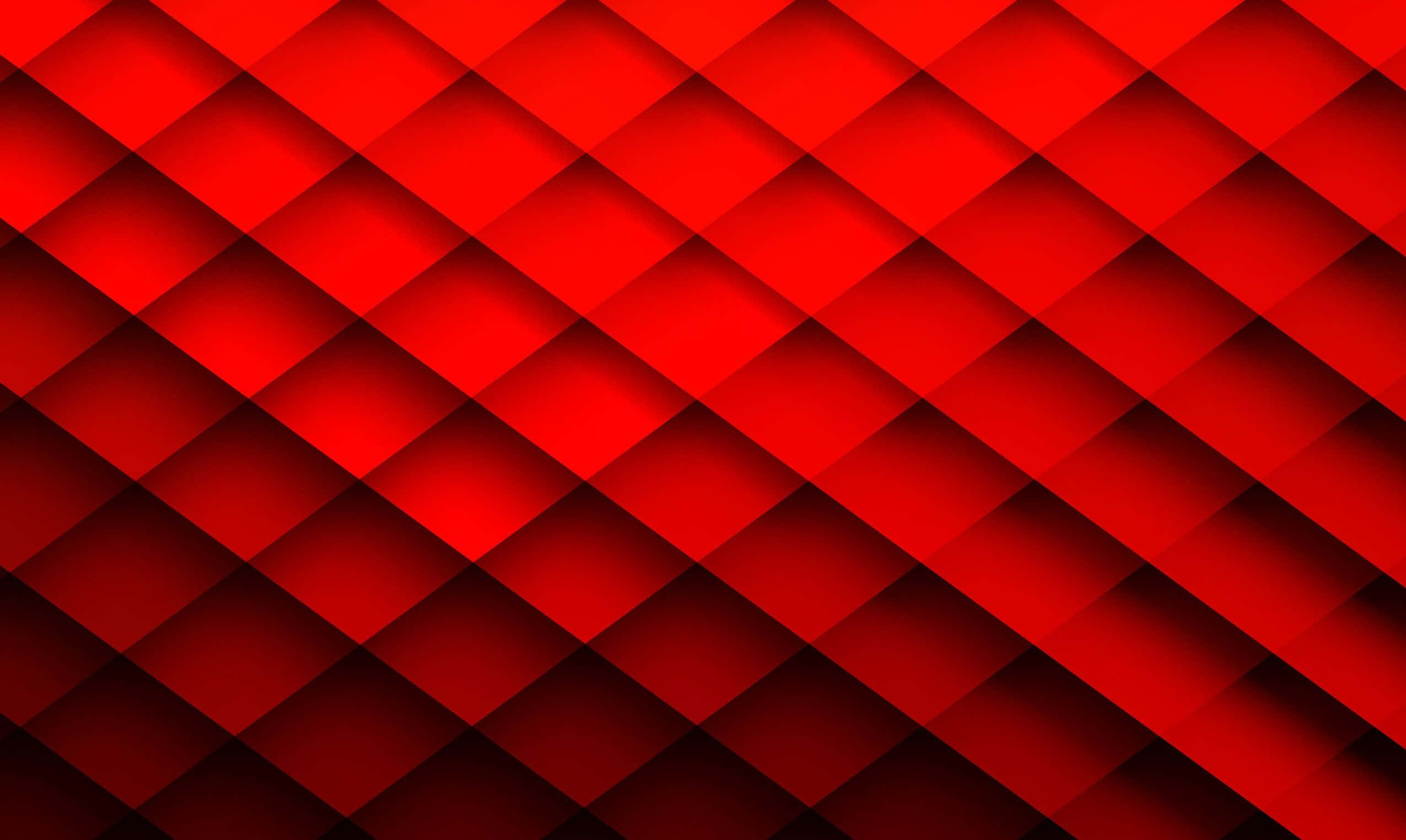 High Resolution Red 桌布 壁紙 — 充滿活力的紅色幾何圖案，重疊的菱形形狀透過漸變陰影營造出動態的3D效果。
