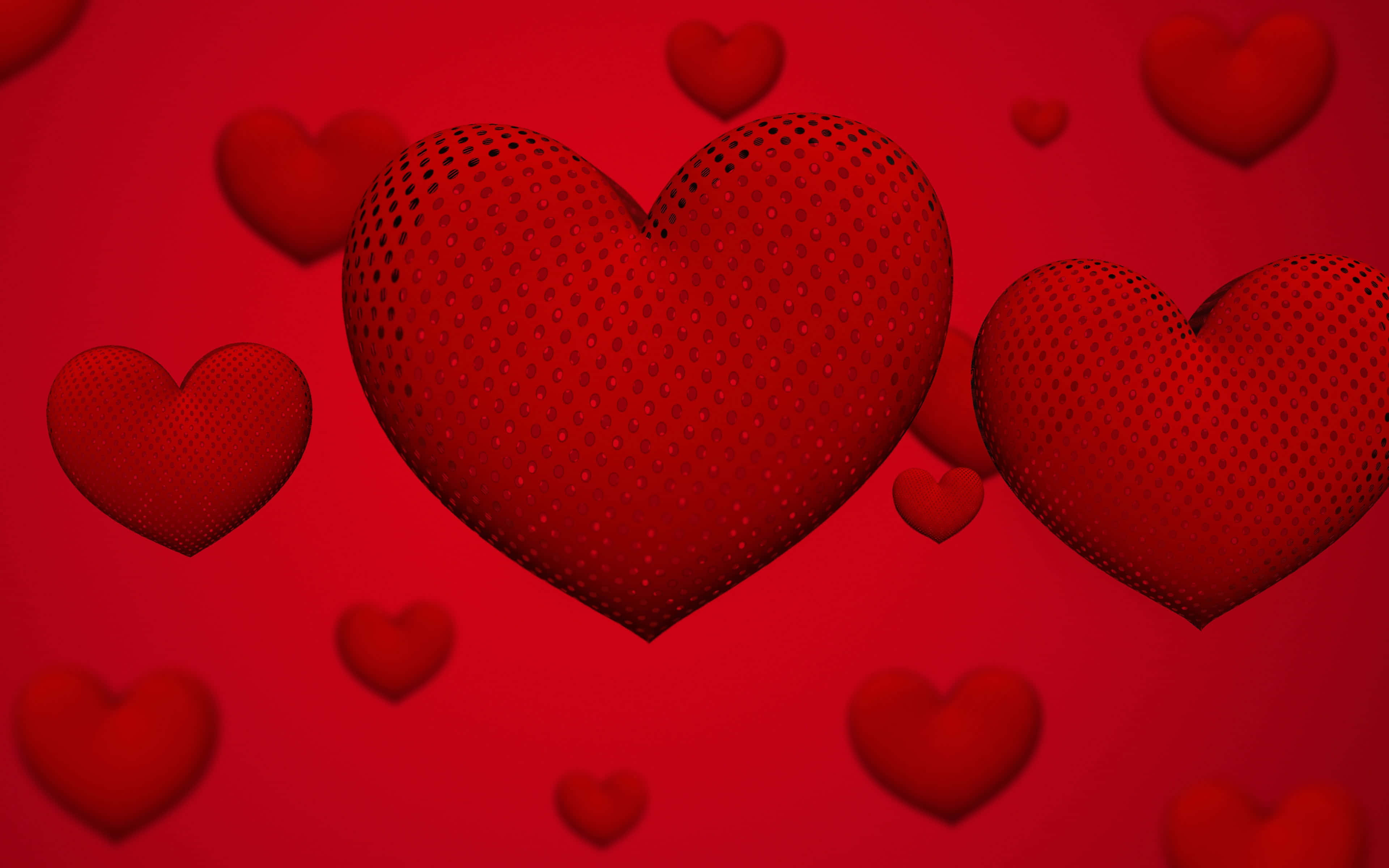 Aesthetic Heart 桌布 壁紙 — 充滿活力的紅色心形，帶有圓點紋理，漂浮在豐富的紅色漸變背景上。