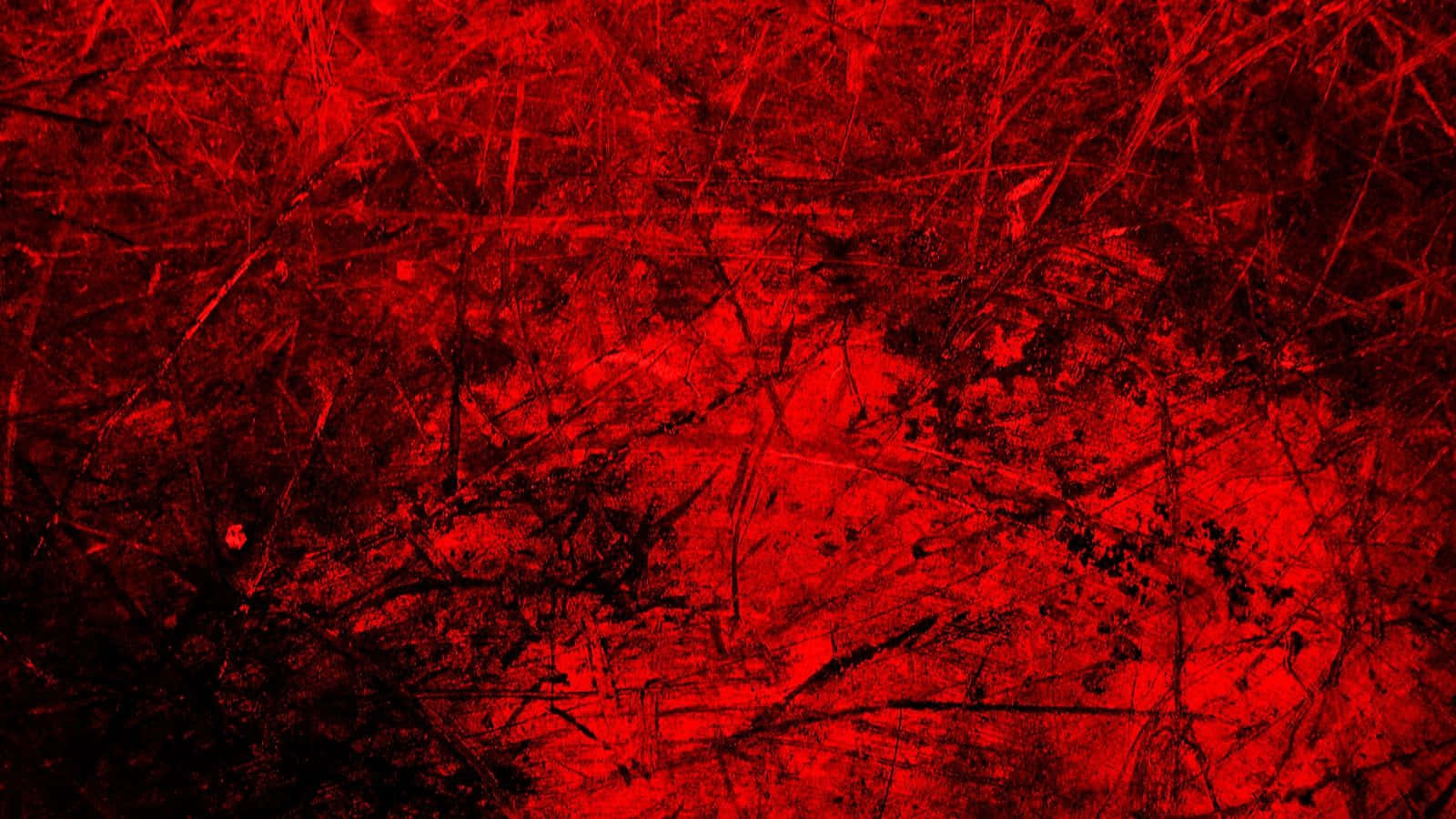 Metallic Red 桌布 壁紙 — 充滿活力的紅色紋理表面，帶有混亂的深色刮痕和污跡，營造出強烈粗糙的抽象圖案。