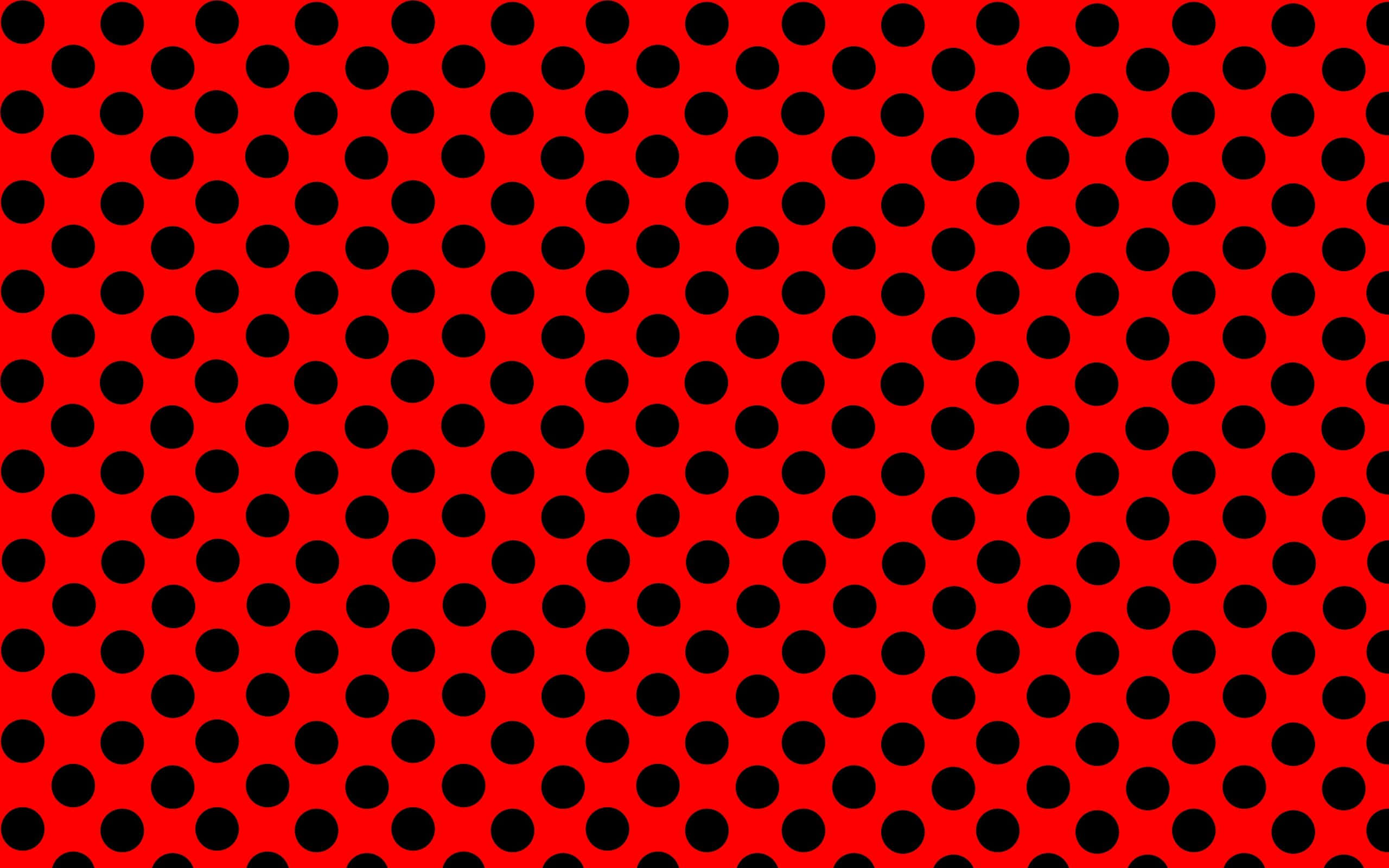 Black Polka Dot 桌布 壁紙 — 充滿活力的紅色背景，帶有重複幾何圖案的大膽黑色圓點。