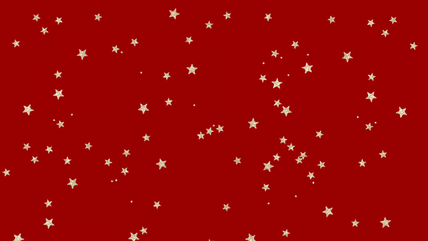 christmas laptop 桌布 壁紙 — 充滿活力的紅色背景，點綴著散落的金色星星和小點，營造出節日天體圖案。