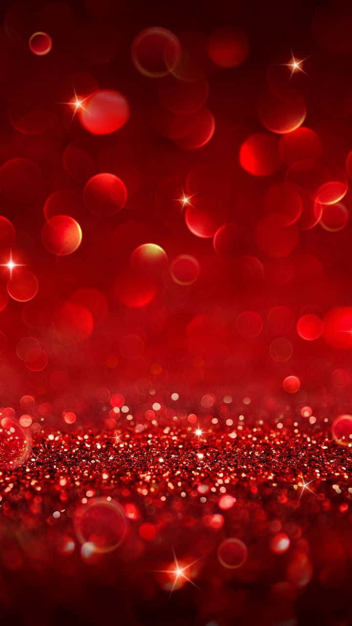 Red Cute Aesthetic 桌布 壁紙 — 充滿活力的紅色閃粉表面，配上閃爍的散景燈光和星芒，營造出節慶而奢華的氛圍。