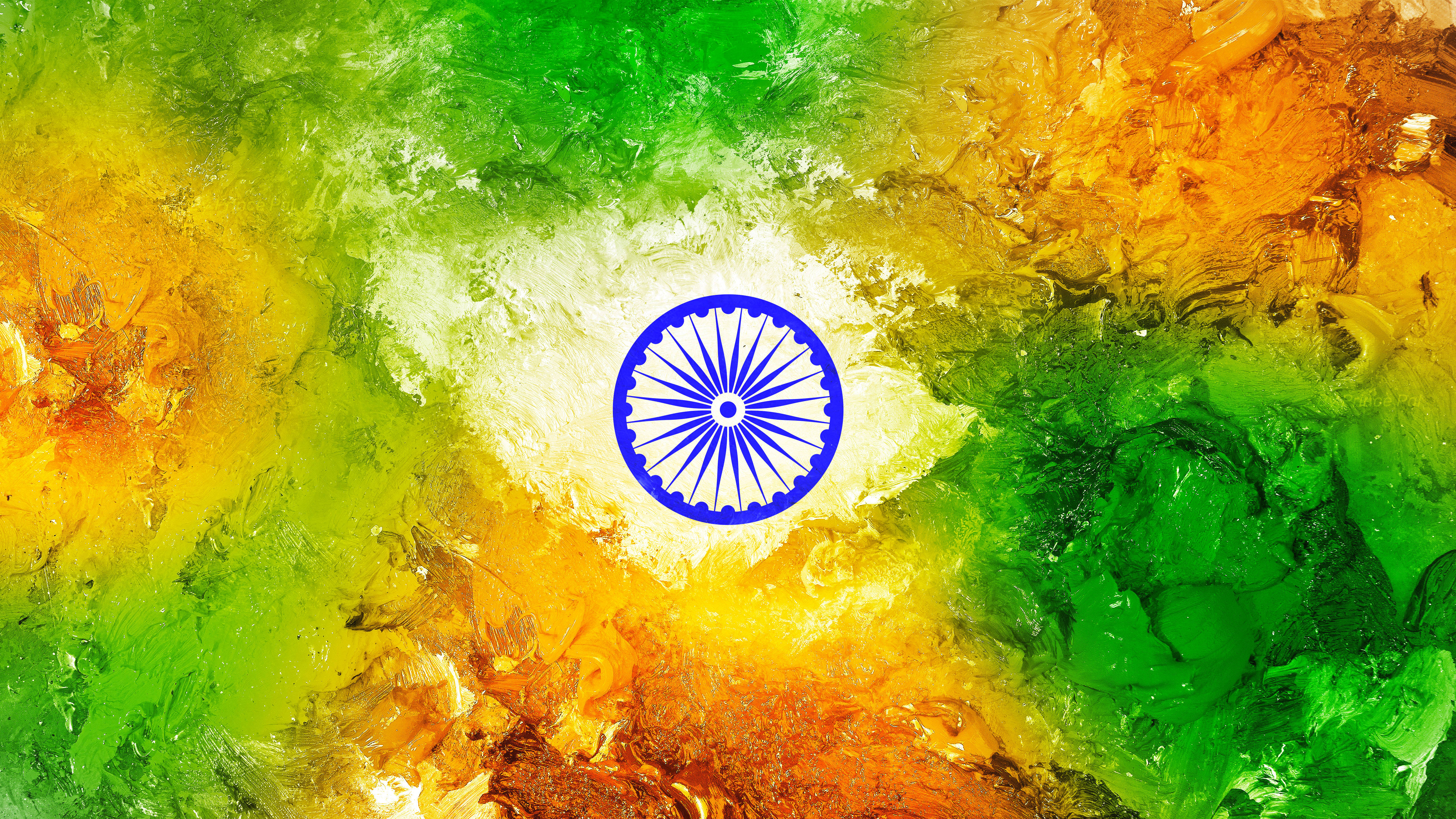 Indian 桌布 壁紙 — 充滿活力的紋理油漆漩渦，以藏紅花、綠色和白色形成印度國旗中央的阿育王法輪標誌。