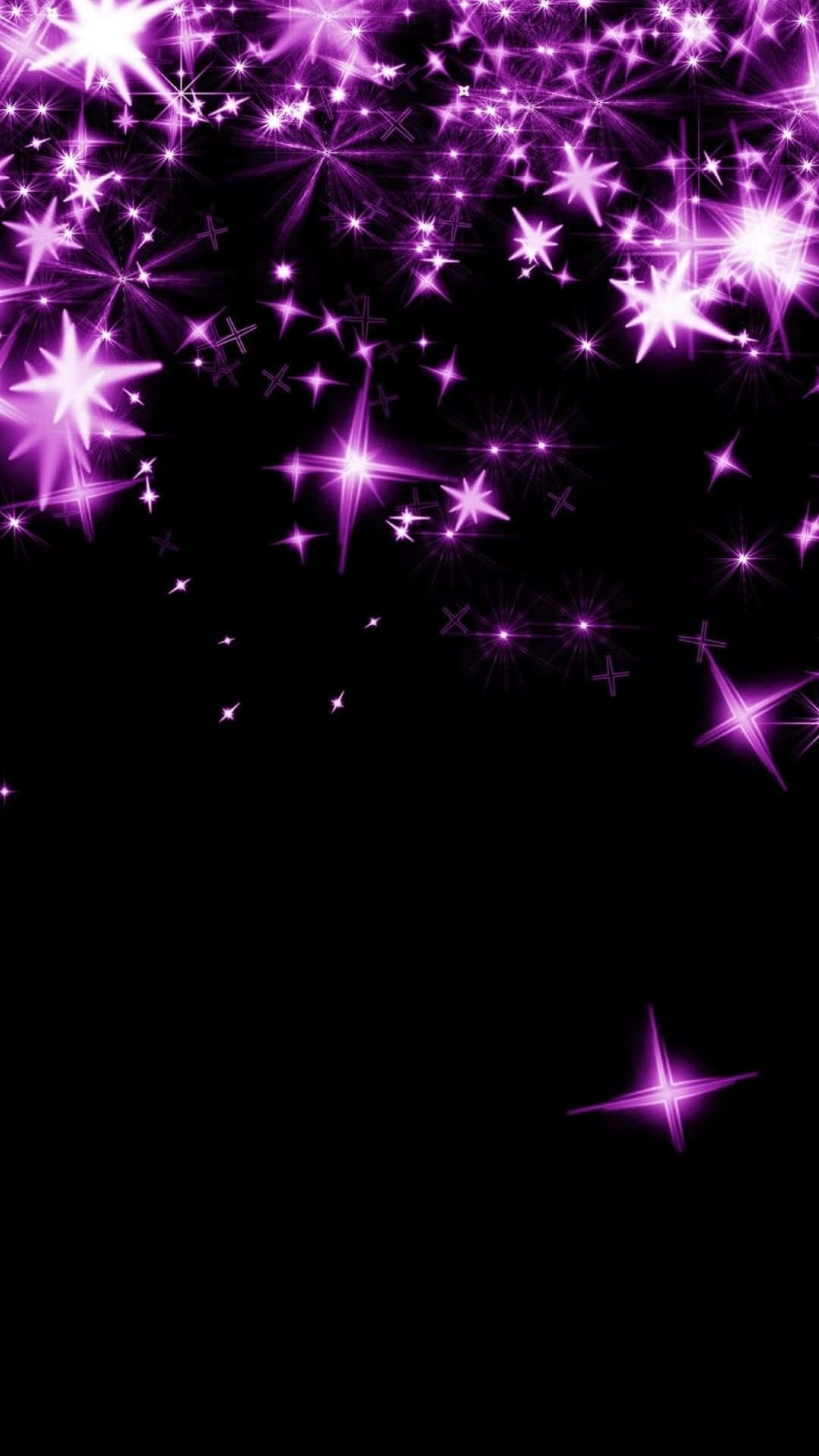 Pink Stars 桌布 壁紙 — 充滿活力的紫色星爆在深邃的黑色虛空中爆炸，創造出令人眼花撩亂的宇宙奇觀。