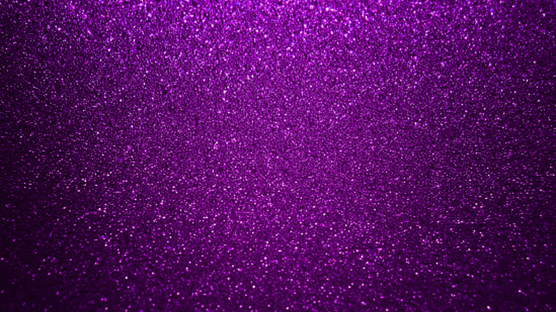 Purple Glitter 桌布 壁紙 — 充滿活力的紫色閃粉紋理，帶有從中心散發的閃爍粒子。