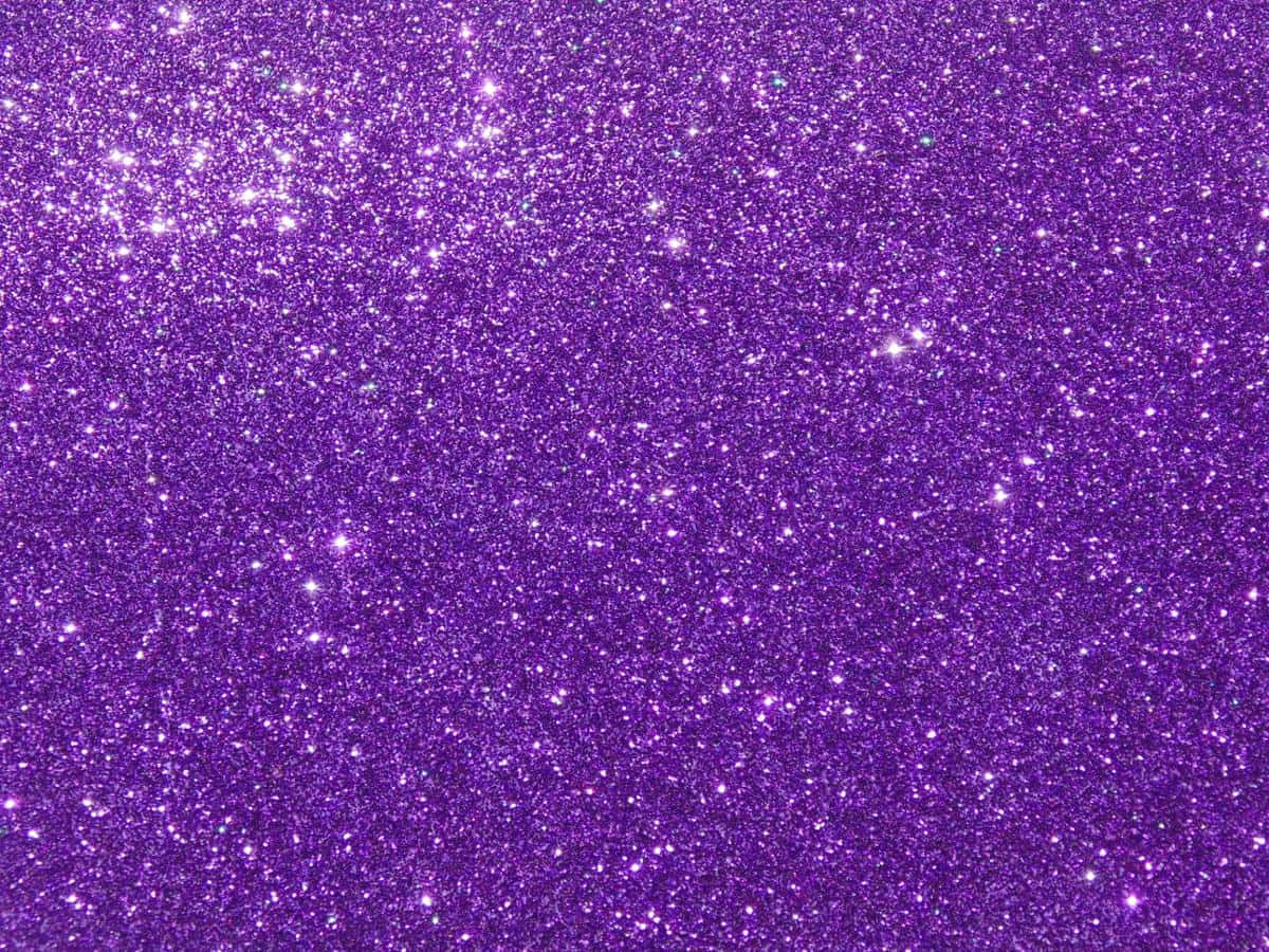 Sparkle 桌布 壁紙 — 充滿活力的紫色閃粉紋理，帶有閃爍的白色和藍綠色斑點，捕捉光線。