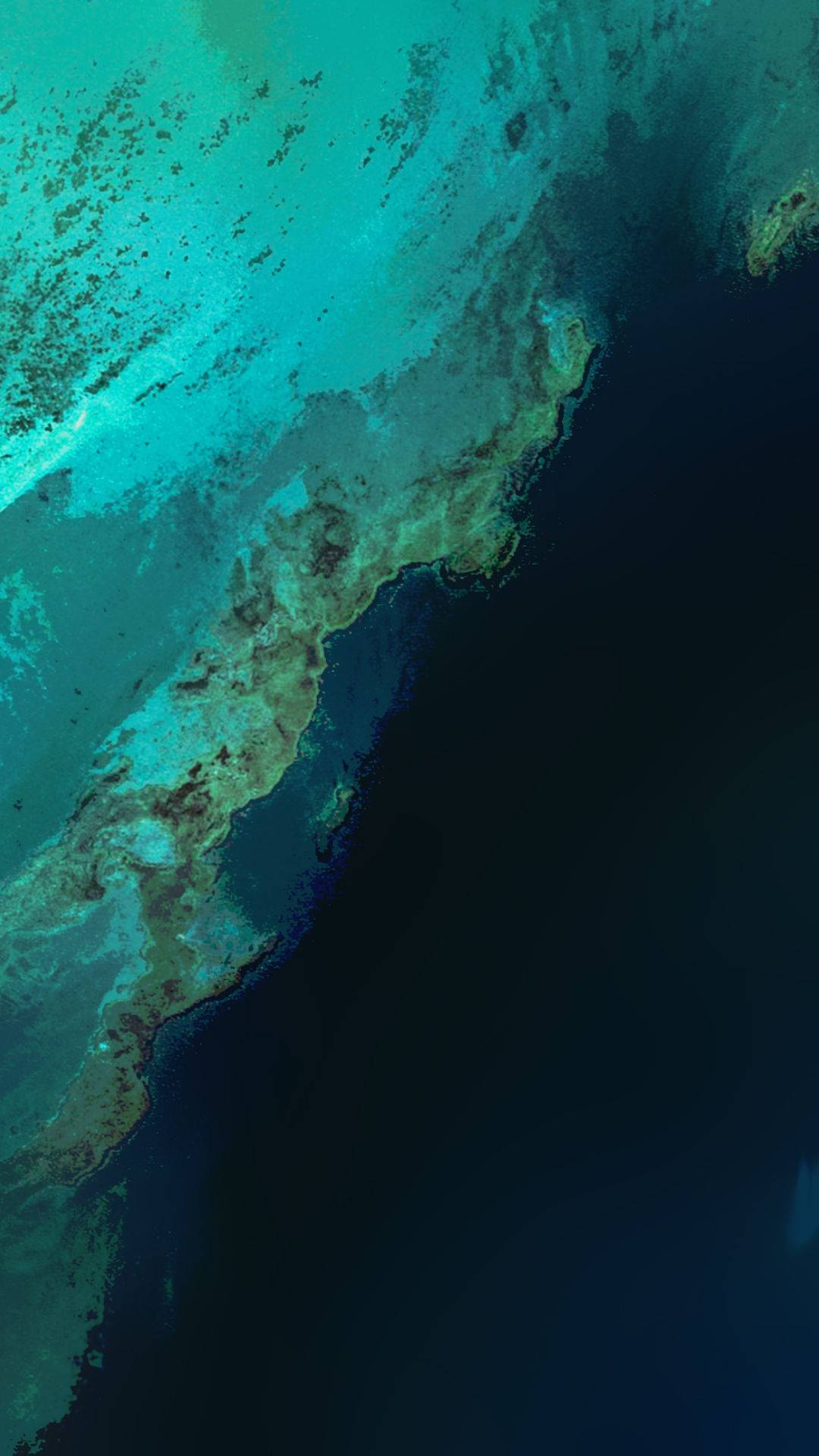 Pixel 桌布 壁紙 — 充滿活力的綠松石珊瑚礁過渡到深海洋藍色的鳥瞰圖。